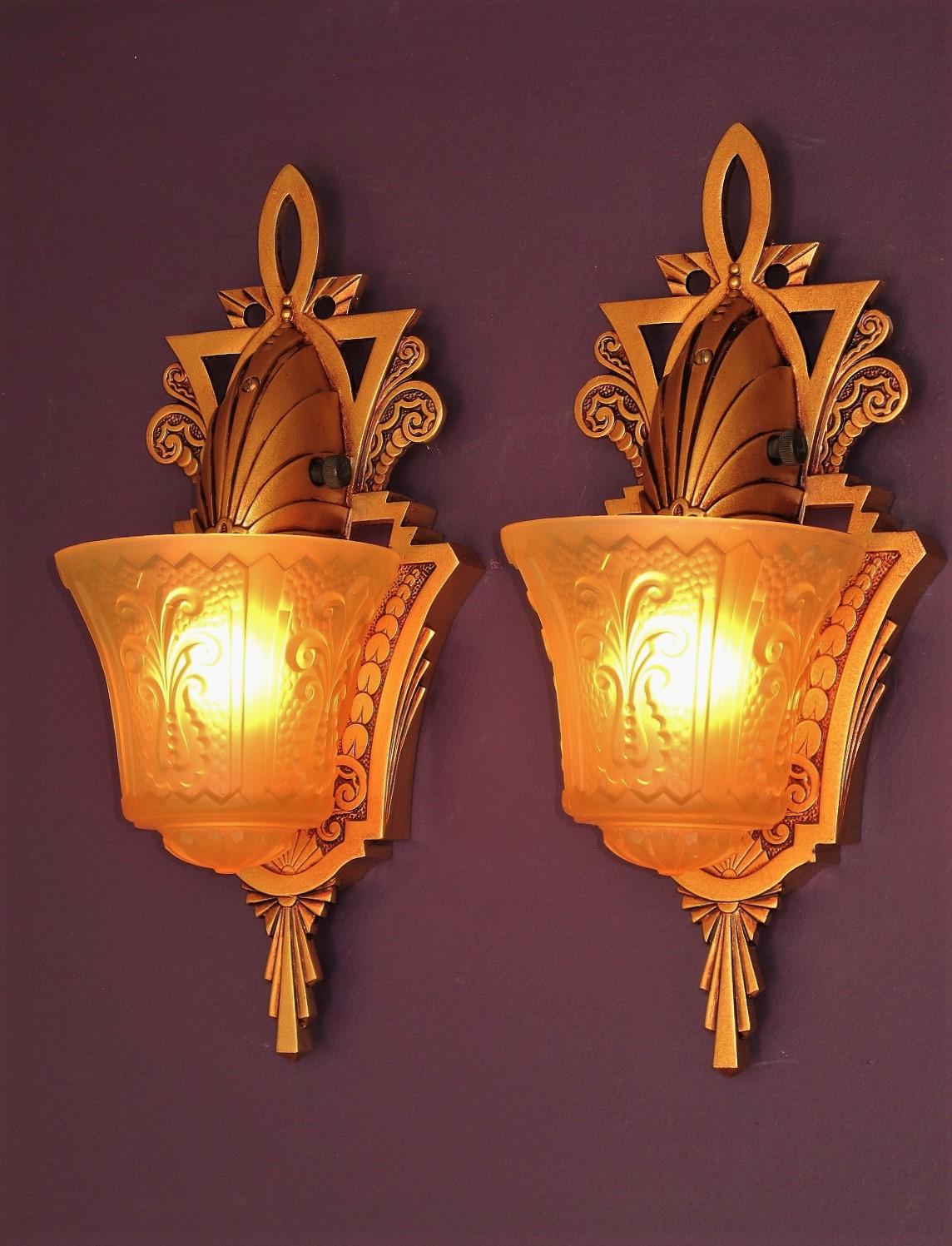 Several pair available, priced per pair.
Harken back to time when Art Deco design was unabashedly bold, striking and beautiful. Patented in 1934 from the world renown fixture designers Beardslee of Chicago.
Refinished in a deep warm sunset golden
