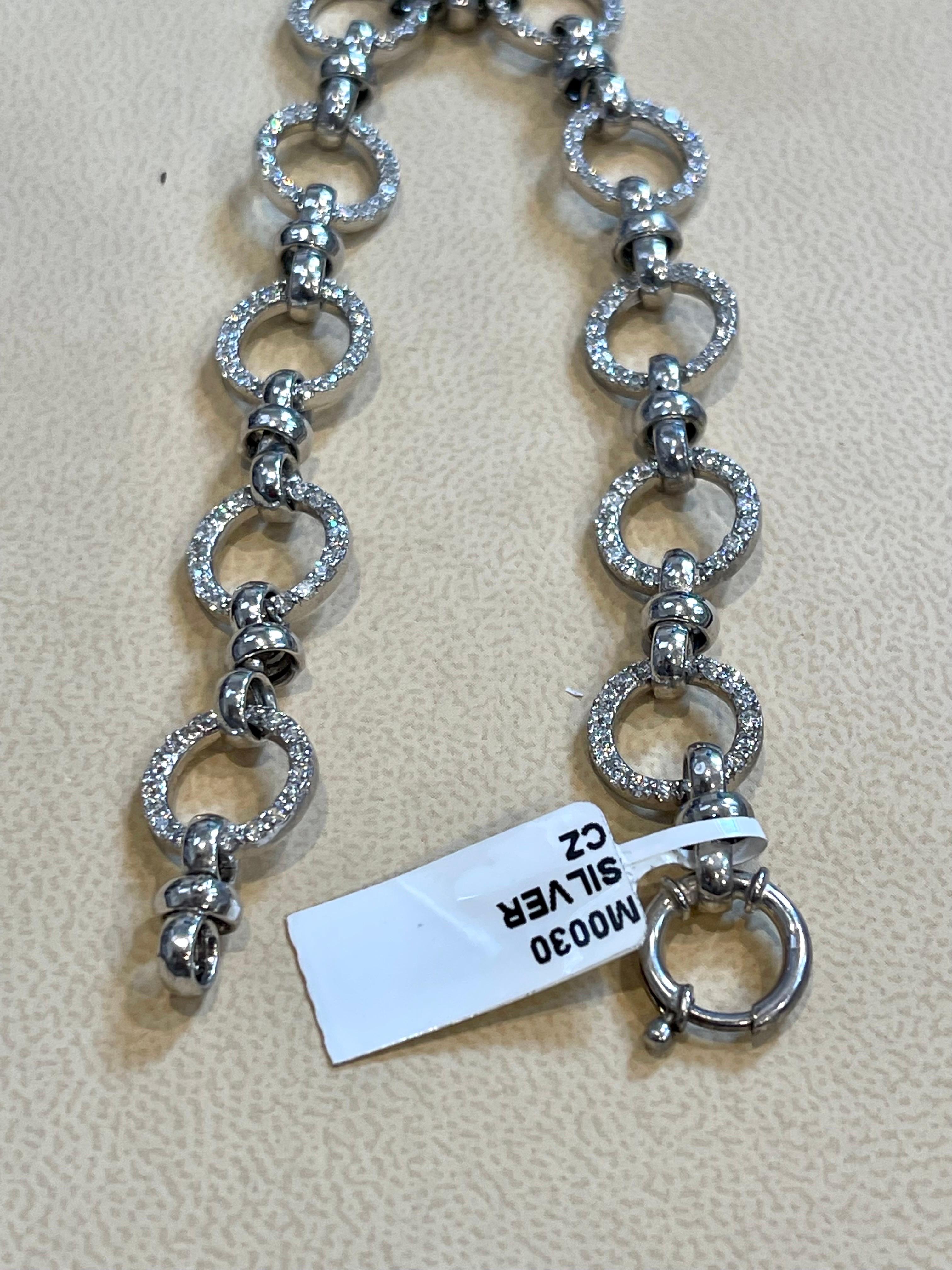  Cubic Zirconia or CZ is the cubic Crystalline form Of Zirconium dioxide. Its Hard and Usually  colorless.
This Bracelet is  amazing . Just looks like diamonds .
Pure sterling silver which will not tarnish over time.
8 inch long

Weight of the