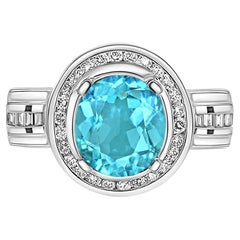 Bague filigrane en platine et or 18 carats avec zircon bleu de 8 carats et halo de diamants 