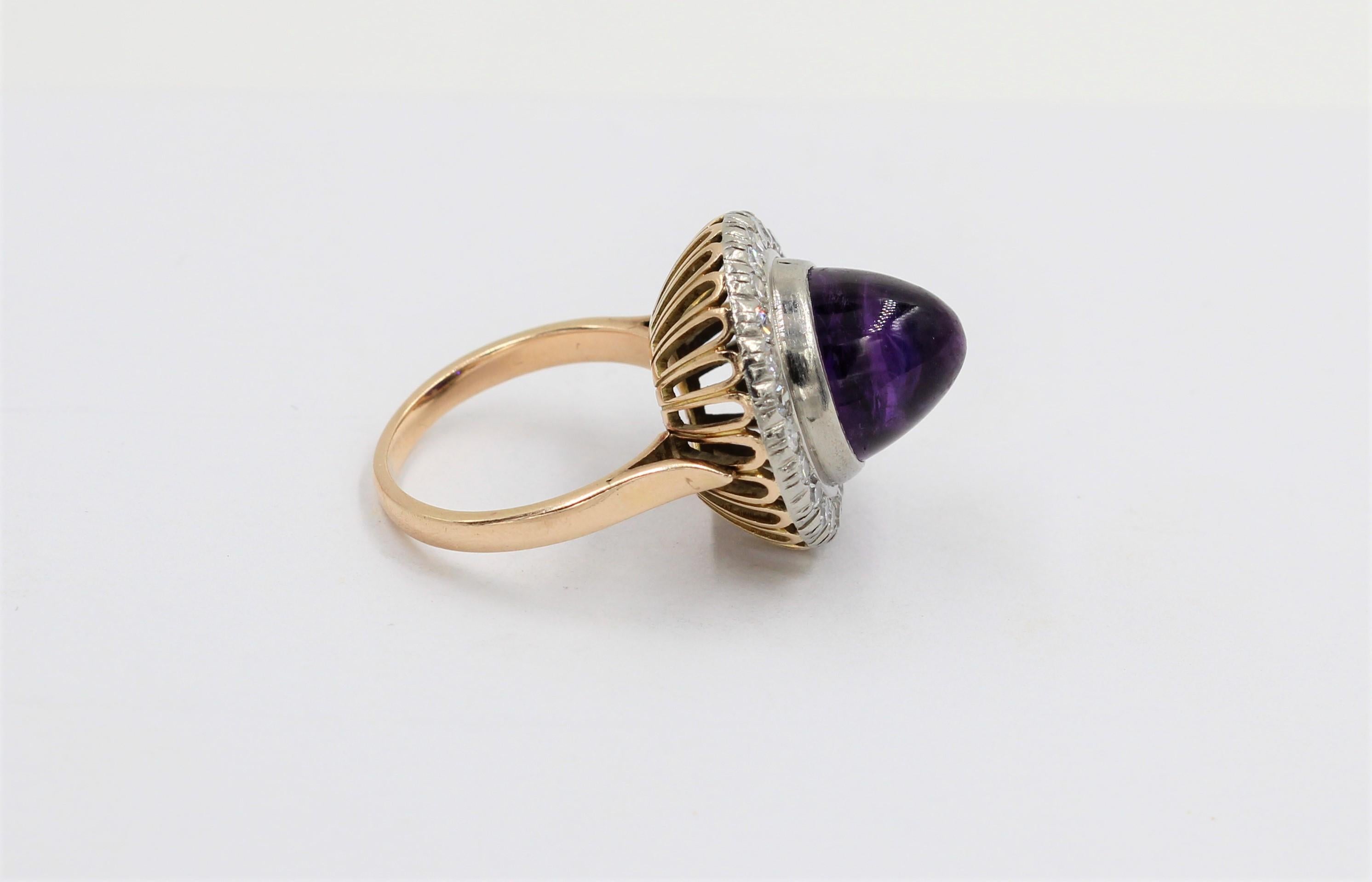 8 Carat Cabochon Amethyst Handcrafted in 14k and Platinum With 1.0 Diamonds.
One Cabochon Cut Amethyst weighing 8 carats approximately 
24 Round Brilliant Cut Diamonds weighing 1.0ct.
Handcrafted in 14k and platinum.

Purple Amethyst has been highly