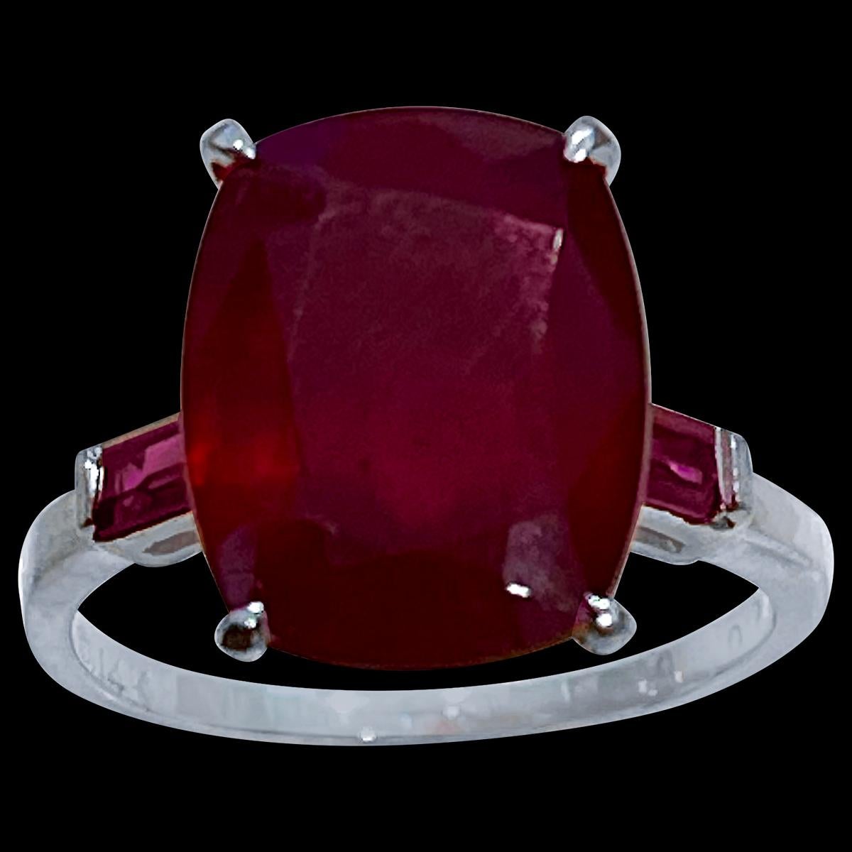 14X10 Cushion Cut   Approximately 8  Carat Treated Ruby  14  Karat White  Gold Ring Size 8
Two ruby Baguettes
Its a treated ruby prong set
14 Karat White  Gold: 5 gram
Ring Size 8  ( can be altered for no charge )
Extremally beautiful and solidly
