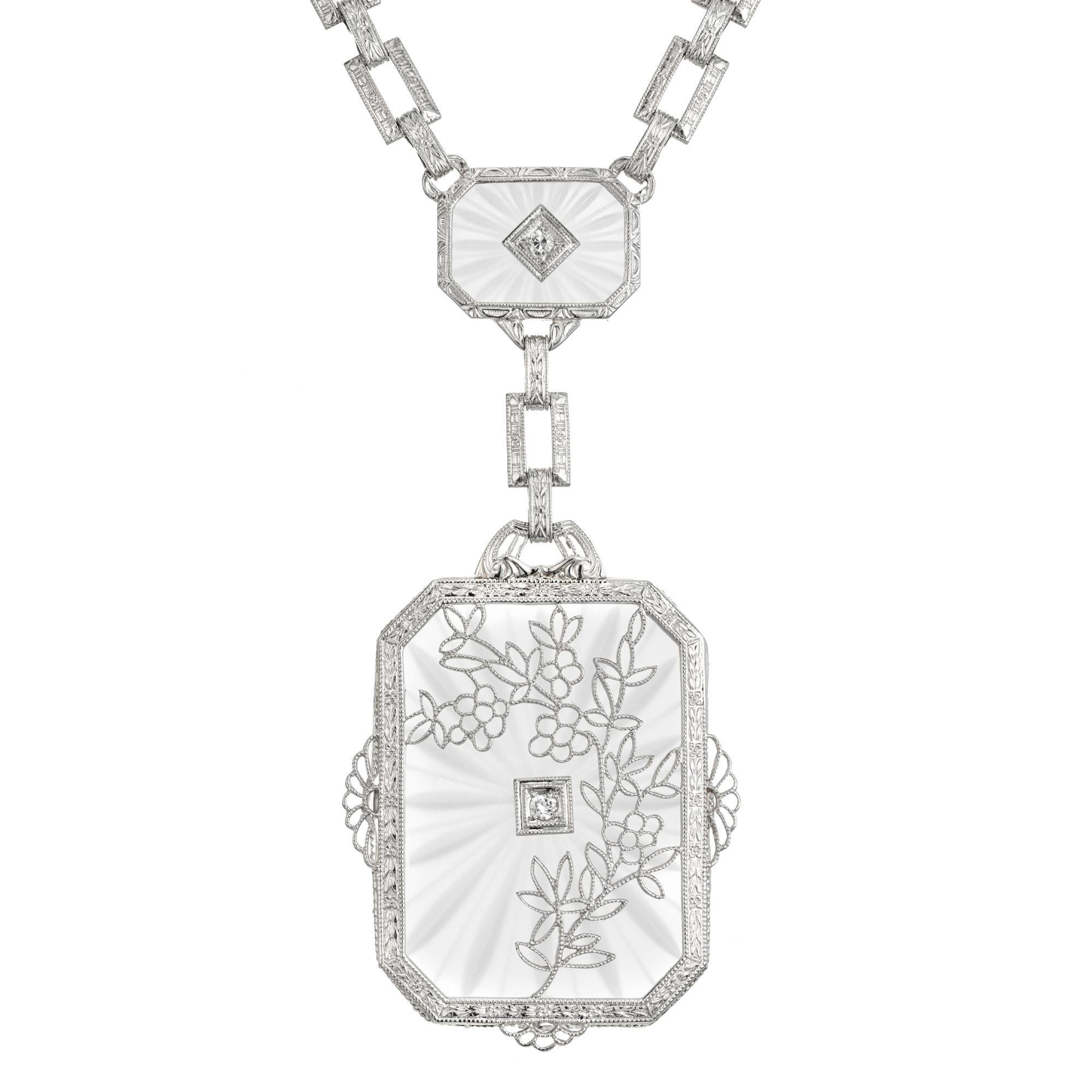 1930's Art Deco quartz pendant necklace. 2 rectangle angel skin quartz framed in 14k white gold with 2 round accent diamonds. Engraved link, 16 inch chain. 

2 rectangle Angel Skin Quartz
2 round full cut diamonds, approx. total weight .08cts, H,