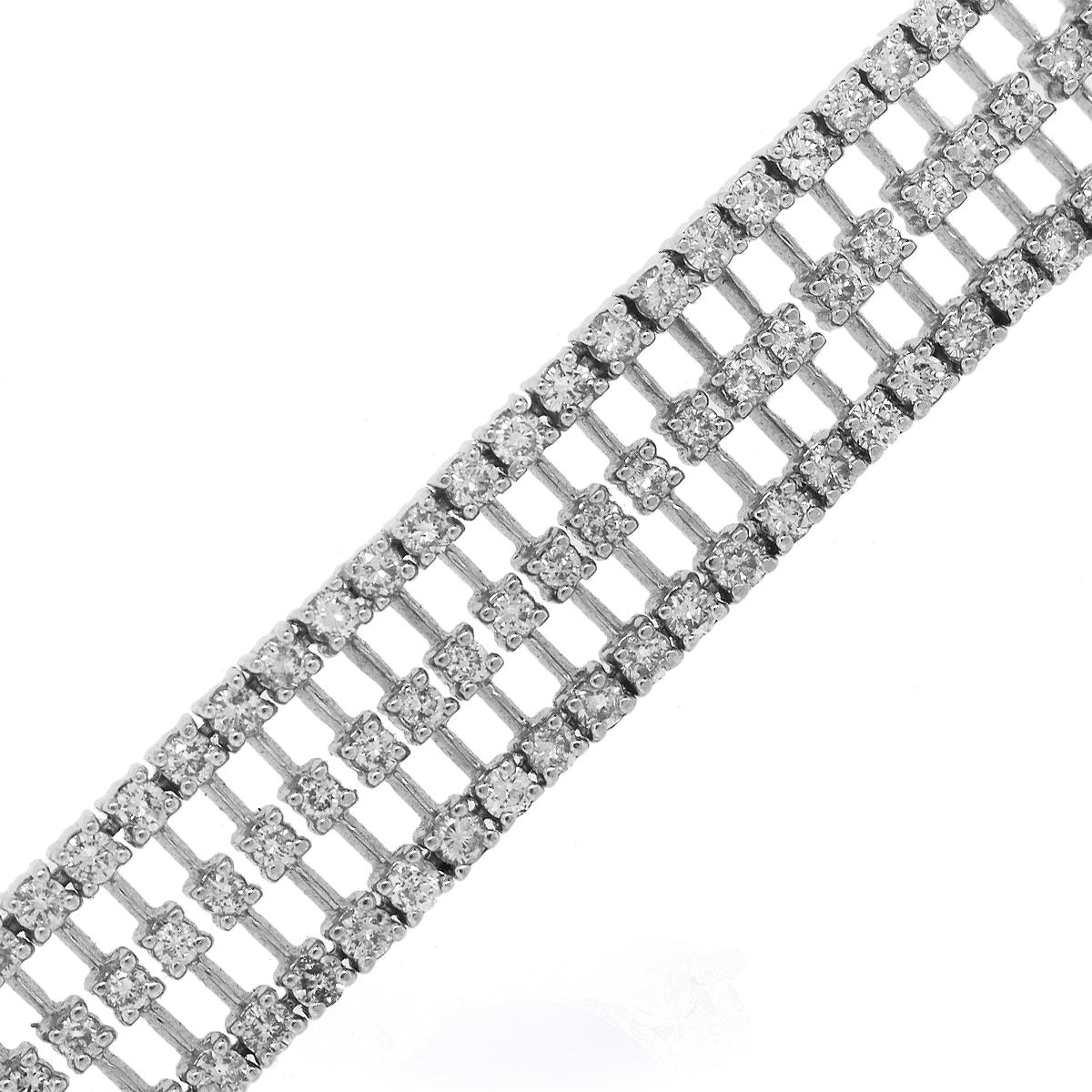 Material: 18k White Gold
Diamond Details: Approximately 8ctw round brilliant diamonds. Diamonds are H/I in color and SI2-SI2 in clarity.
Clasp: Tongue in box clasp with safety latch
Total Weight: 57.8g (37.2dwt)
Measurements: 7