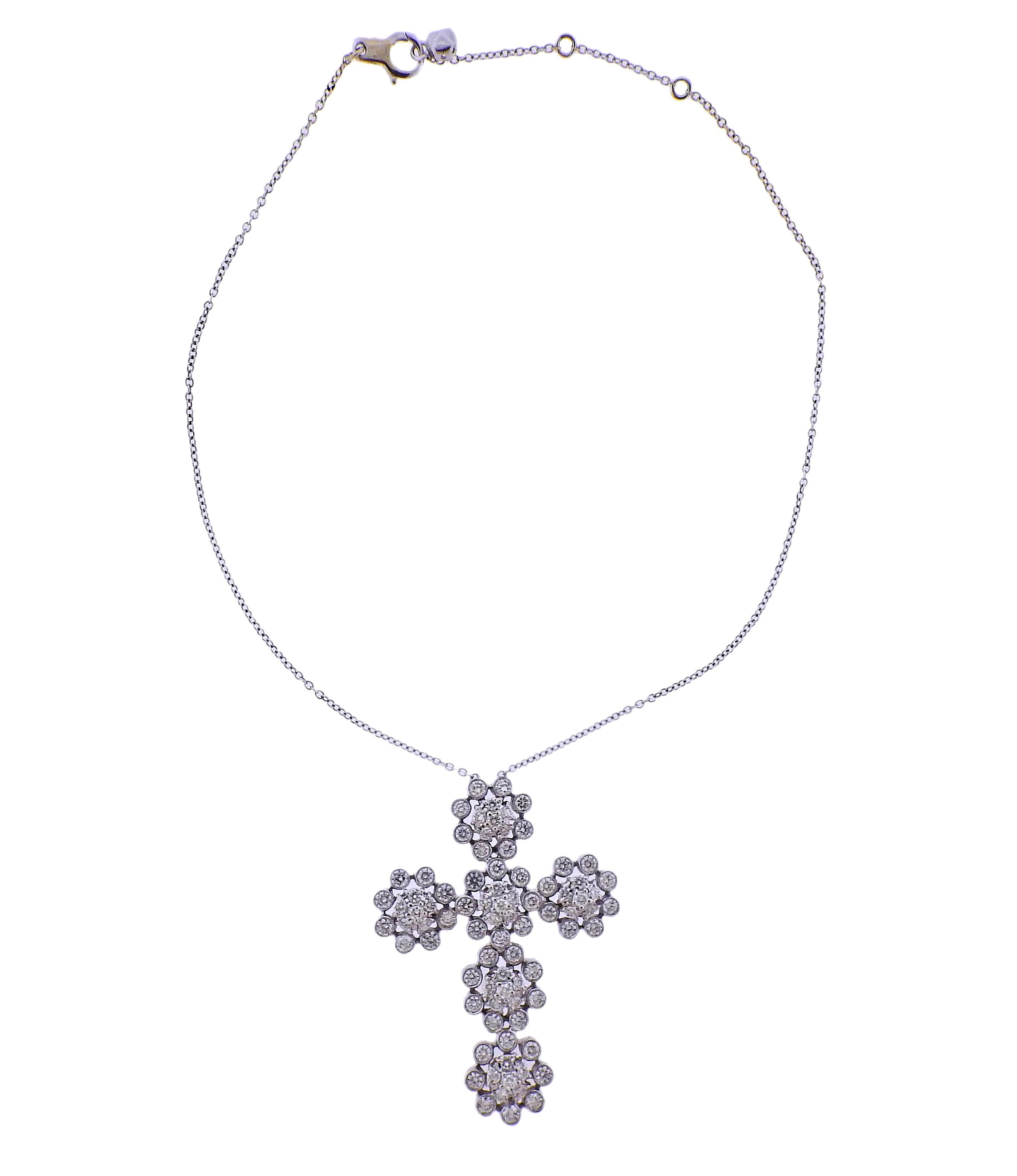 Impressive 18k white gold cross pendant on a chain necklace. Set with approx. 8 carats in diamonds. Necklace is 16.5