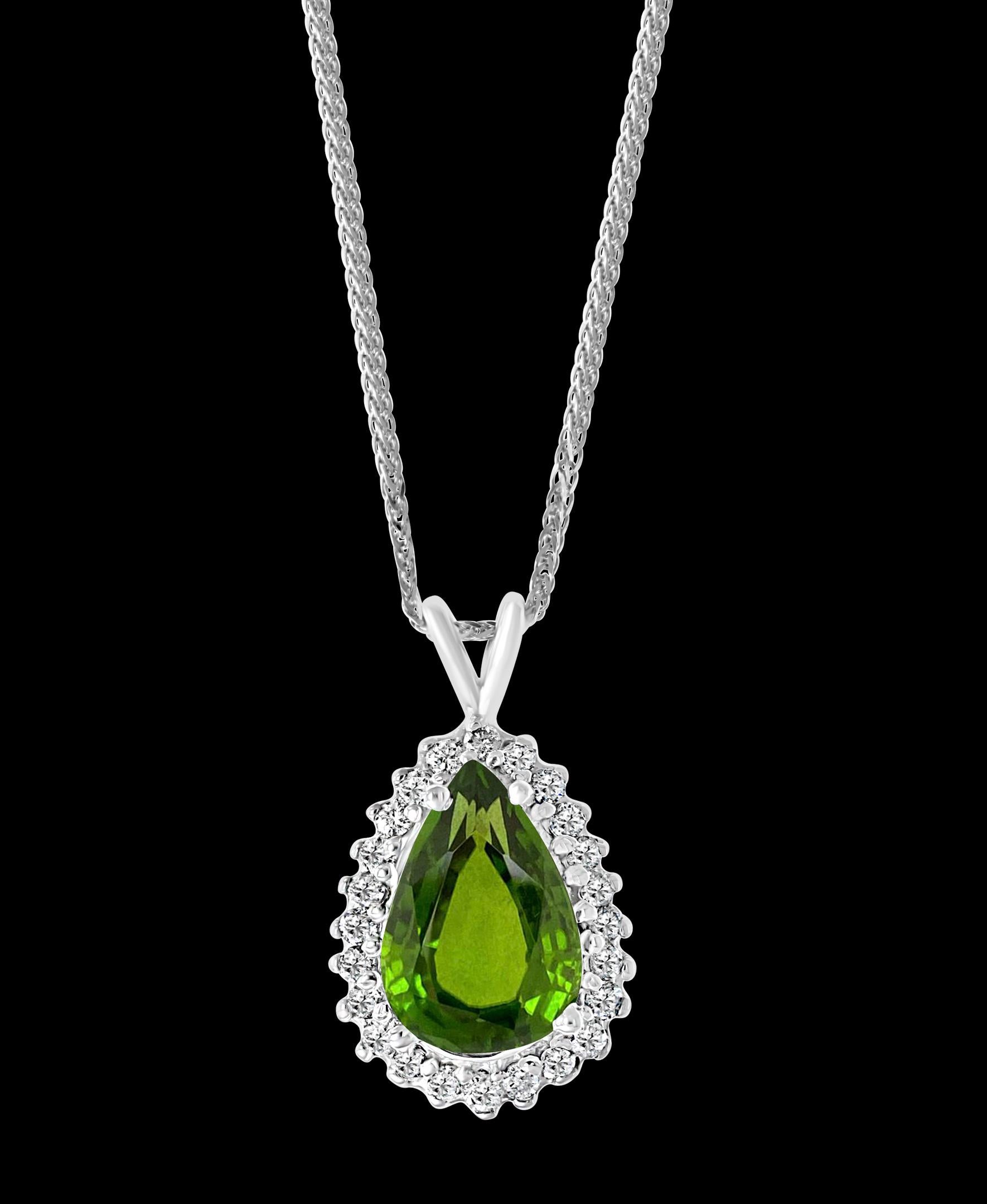 Approximately  8 Carat Green Tourmaline and 1.5 Carat Diamond Pendant / Necklace 14 Karat Gold
This spectacular Pendant Necklace  consisting of a single Pear Shape Green Tourmaline approximately 8  Carat.  The  Green Tourmaline  size  16 X 12 is