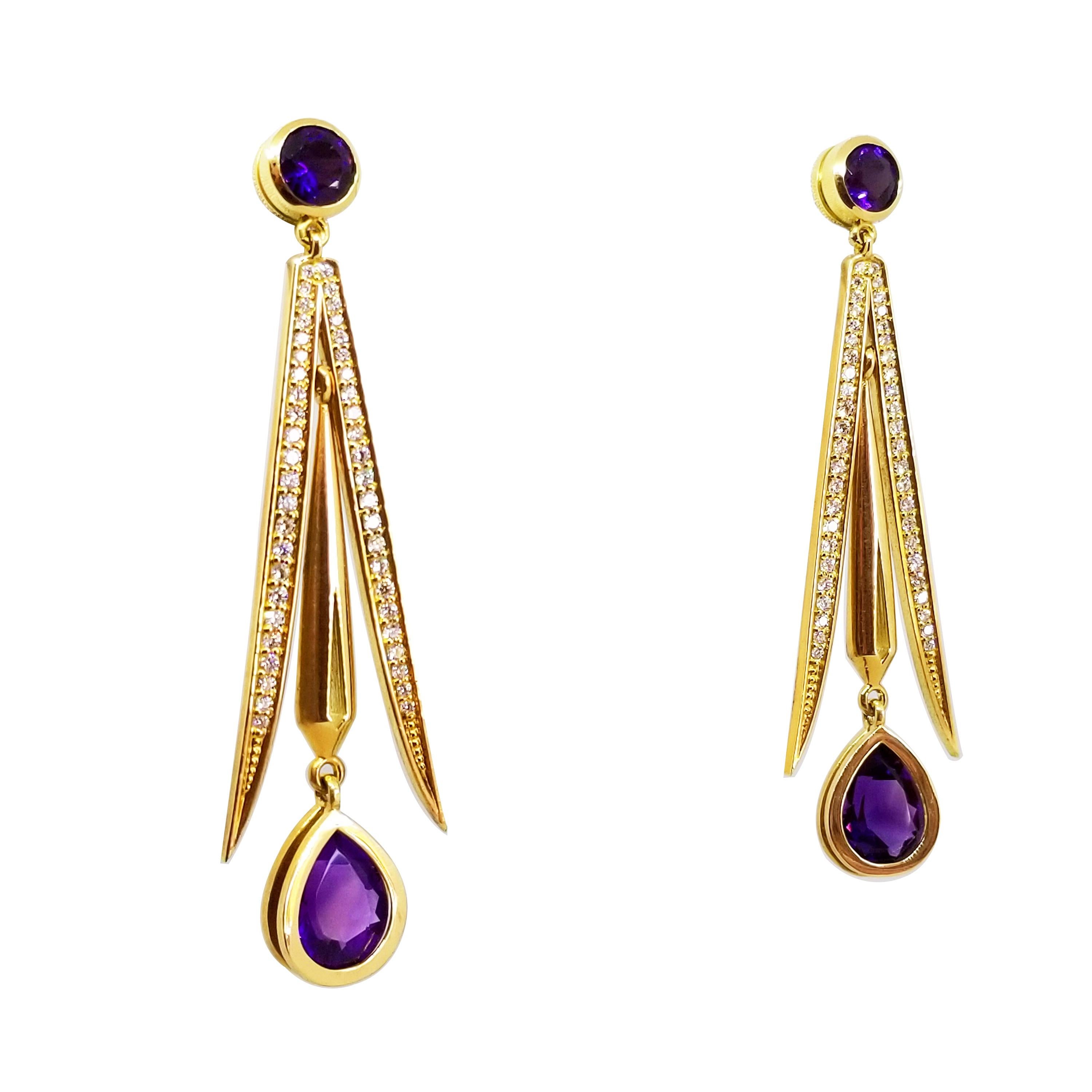 These Long and Elegant Statement Earrings are One of a Kind in 18K Yellow Gold. The Dramatic Earrings feature faceted, Pear Shape and Round Amethysts of Intense Purple Hue and Gem Quality. At the ear, each bezel set, Round Amethyst Gemstone measures