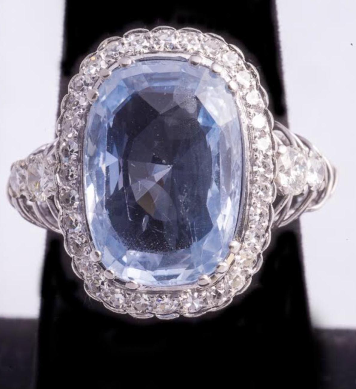 Sapphire and Diamond Ring featuring an 8 Carat Unheated/Untreated Ceylon Sapphire in a Platinum Setting surrounded with 1.24 Full and Half Cut Diamonds