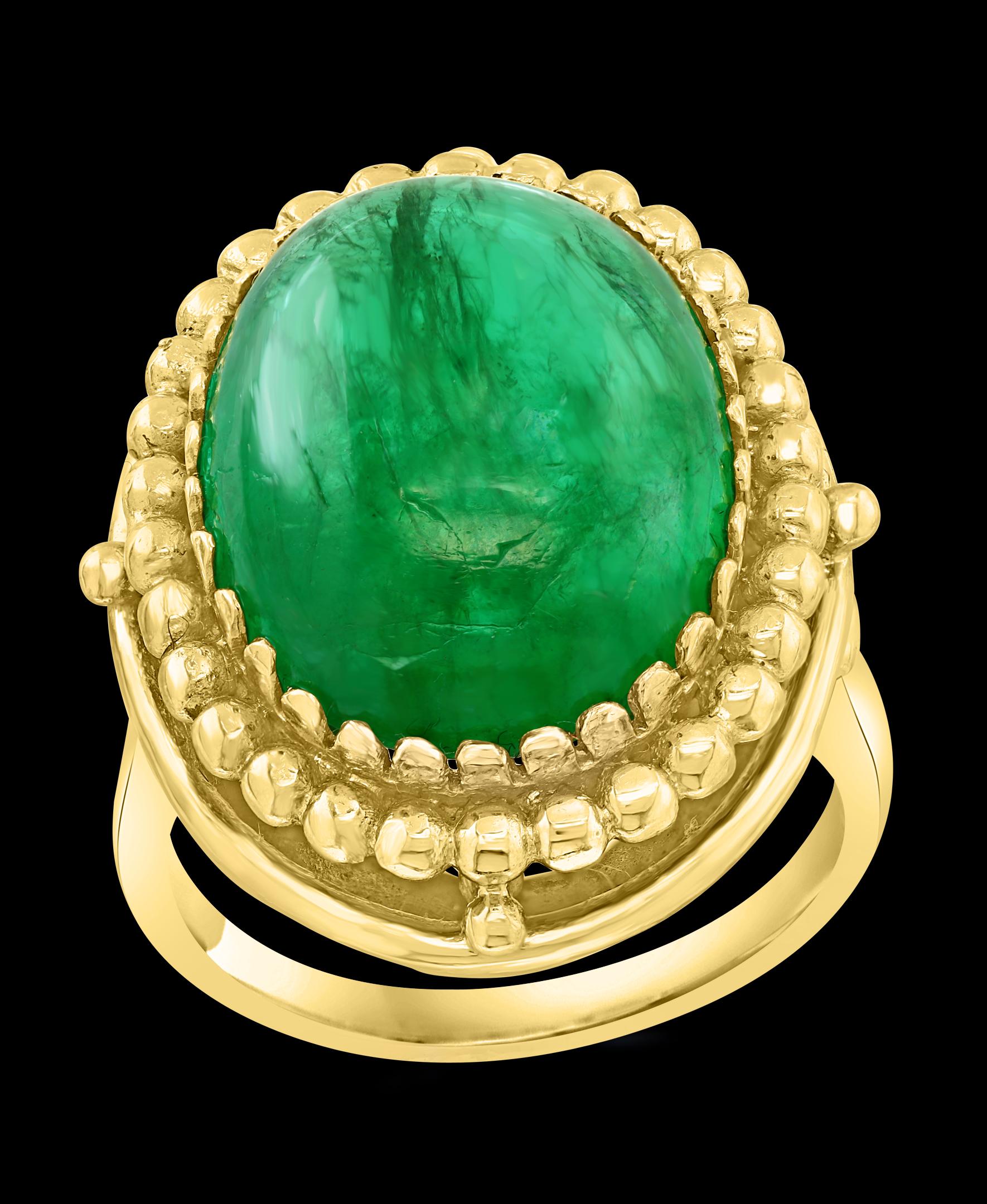 A classic, Cocktail ring 
Large size Emerald  cabochon approximately 8 Carat Emerald , Estate with no color enhancement. 
Gold: 14 Karat Yellow  gold 
Weight: 9.1gram with stone 
simple ring , no bling 
Emerald: 8 Carat 
Origin : Zambia
Color: Deep