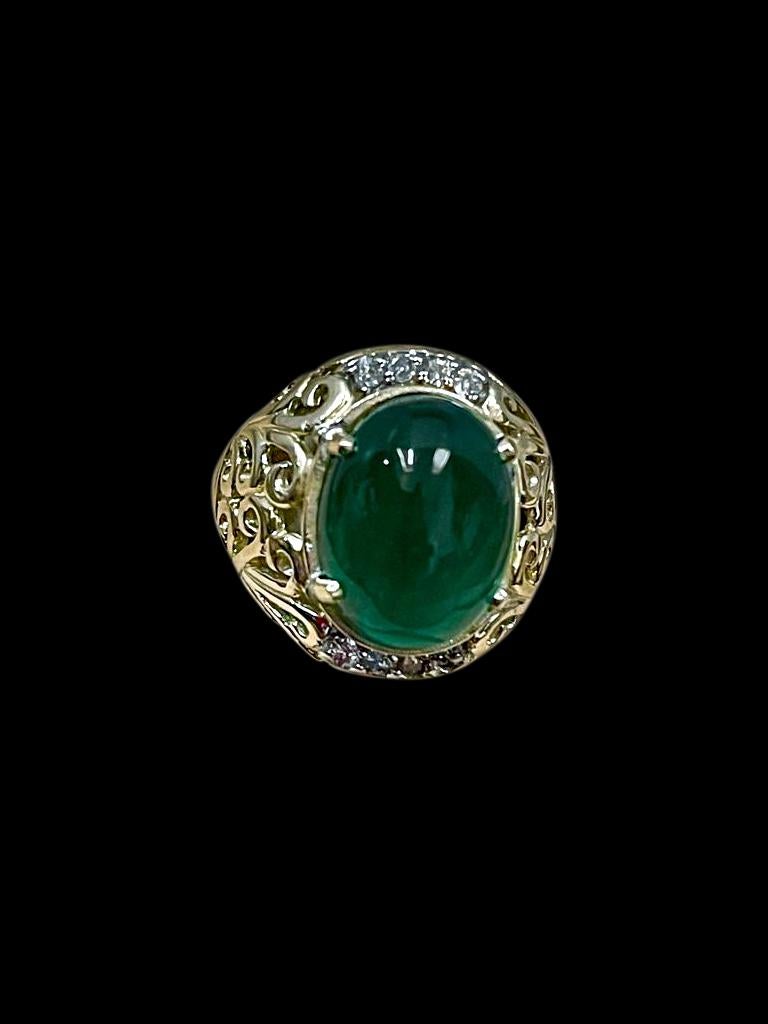 A classic, Cocktail ring 
Large size Emerald  cabochon approximately 8 Carat Emerald , Estate with no color enhancement. Vintage 
Gold: 14 Karat Yellow  gold ,
Weight: 8.5  gram with stone 
simple ring , no bling , few brilliant cut diamonds