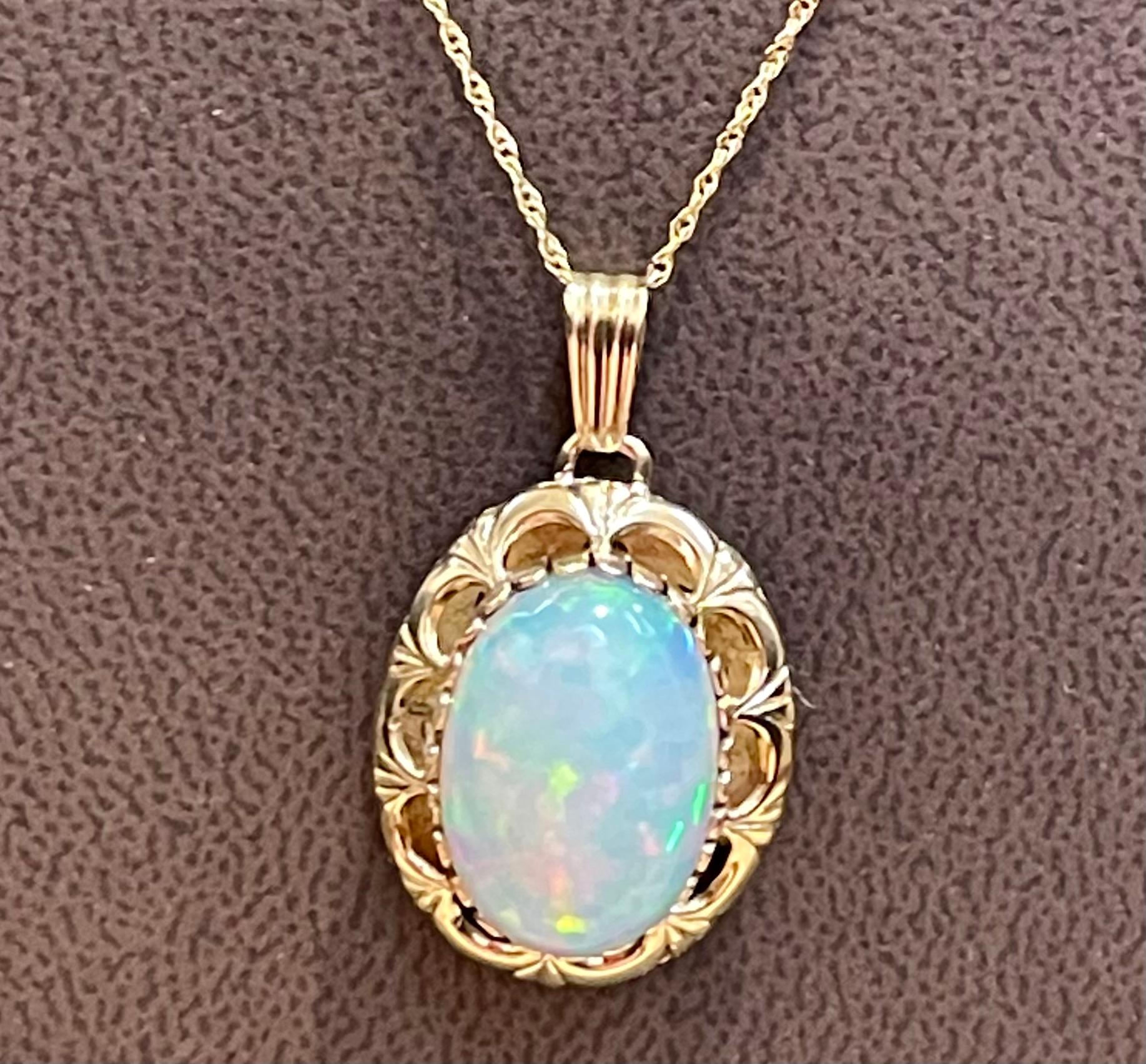 Approximately 8 Carat Oval Ethiopian  Opal Pendant /  Necklace 14 Kt Gold Necklace with Chain
This spectacular Pendant Necklace consisting of a single Oval Shape Ethiopian Opal Approximately 8 Carat. 
14 X 18 mm oval opal
very clean Stone no