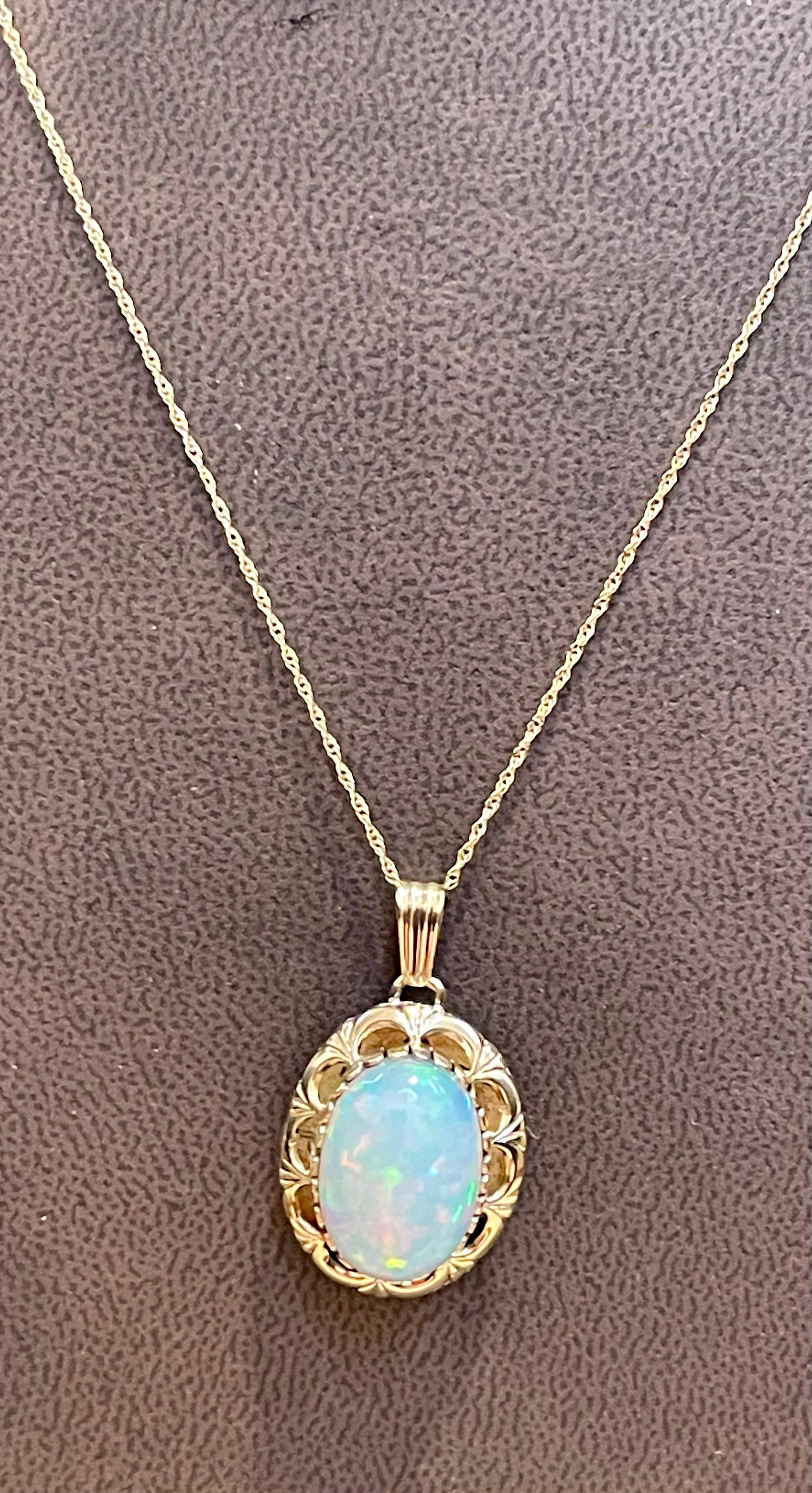 8 Carat Oval Ethiopian Opal Pendant / Necklace 14 Karat Yellow Gold Necklace 1