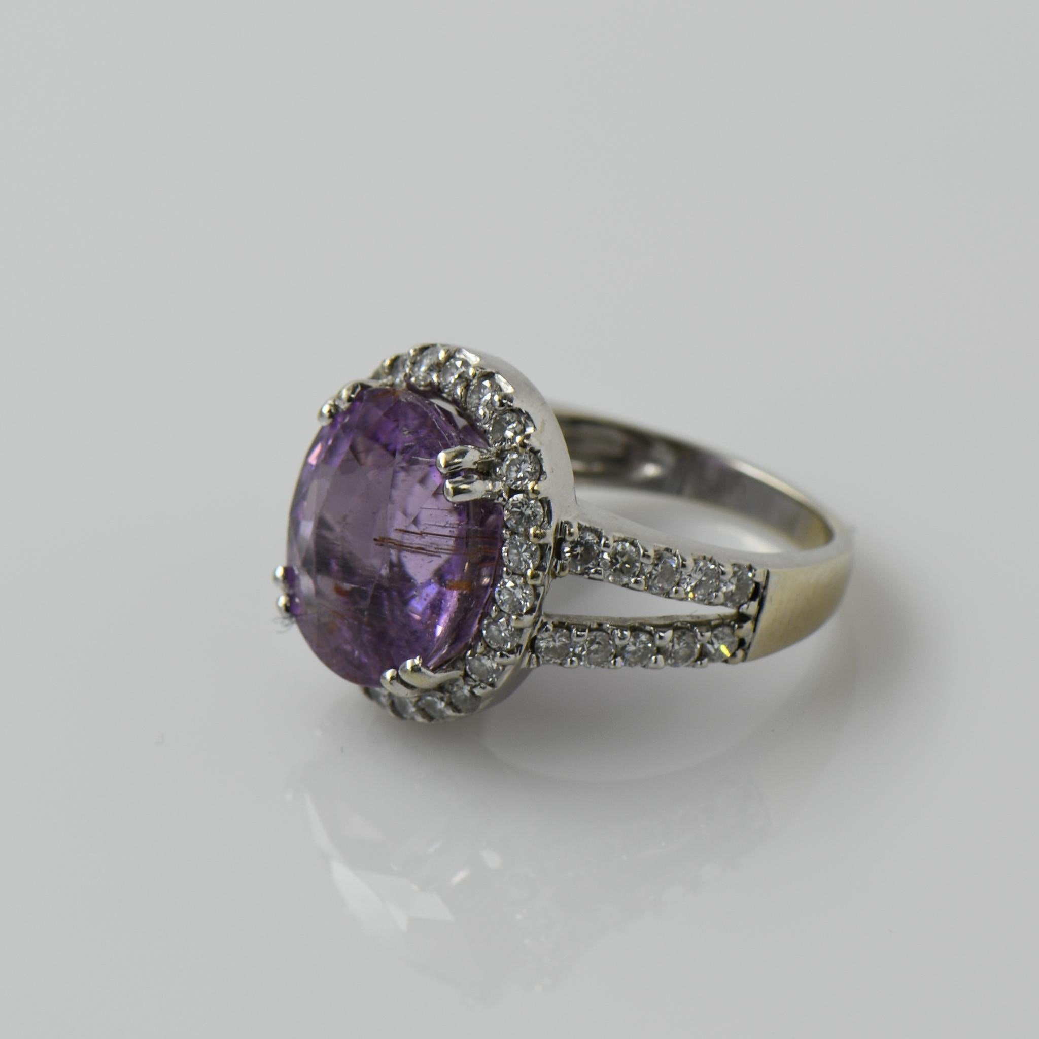 Size: 6.25
Metal Type: 18K White Gold
Weight: 8.5G
Gold Melt Value: $510
Width: 16.82mm to 2.35mm at shank
Finger to Top of Ring: 8.48mm
Hallmarks: 750

Primary Gem Details: 
Type: Kunzite
Quantity: 1
Cut: Oval
Carat Weight: Aprox 8cts

Secondary