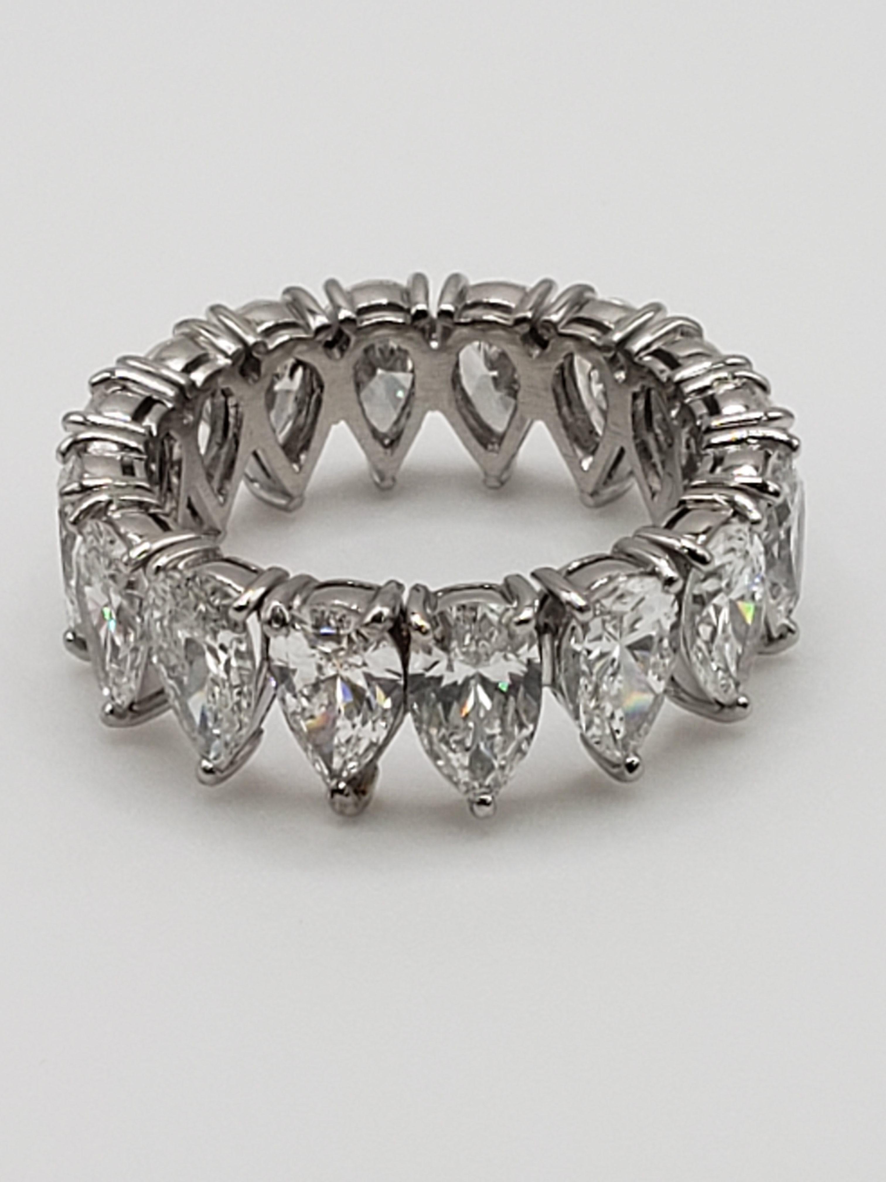 An authentic diamond and platinum ring, circa 1940's/50's (Retro), all handmade, forged in platinum, set with 16 tear-drop/pear shaped natural diamonds each measuring approximately 7.00 x 4.50 x 2.70 mm. The total Carat weight is approximately 8,