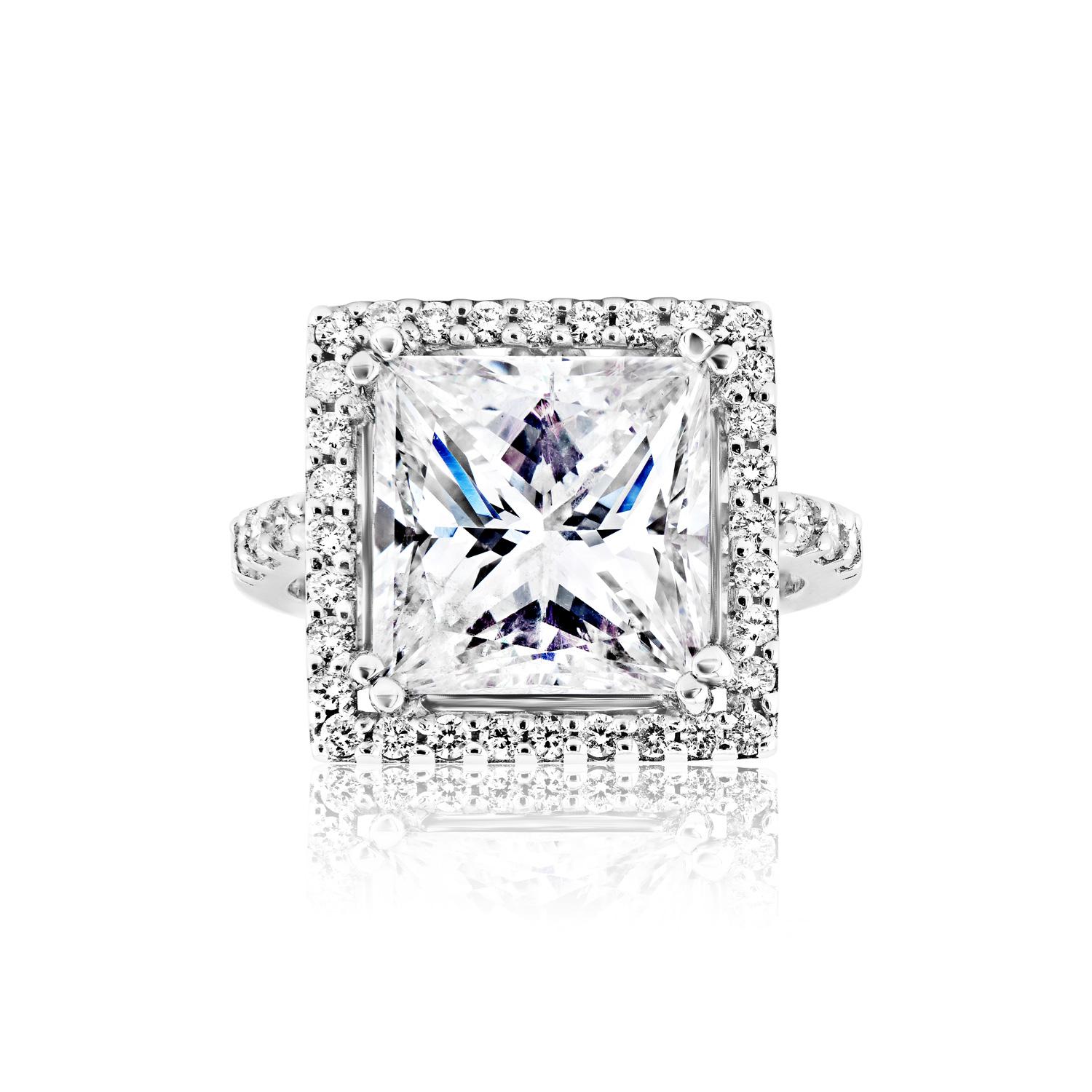 Center Diamond:

Carat Weight: 6.32 Carats
Style: Princess Cut - Feather Filled- Spl Care Req'd

Ring:
Settings: Halo, Sidestone  & 4 round prong
Metal: 18 Karat White Gold 9.40 Grams
Style: Round Brilliant Cut
Diamonds: 1.05 Carats
Size: Can be