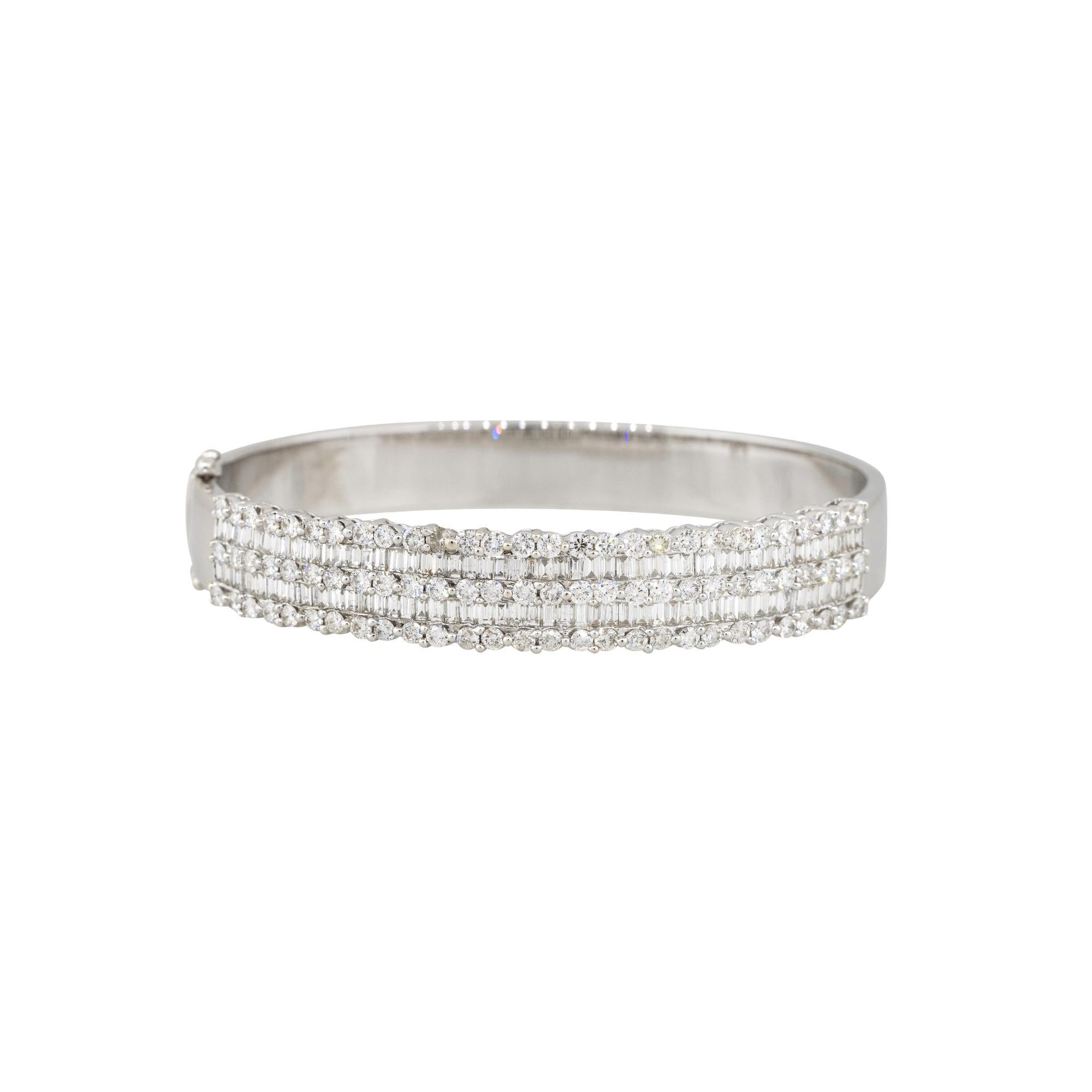 Material: 18k White Gold
Diamond details: Approx. 8ctw of round & baguette cut Diamonds. Diamonds are G/H in color and VS in clarity
Clasps: Tongue in box with safety pin
Measurements: 61.5mm x 10mm x 56.50mm
Total Weight: 31.1g (20dwt) 
Additional