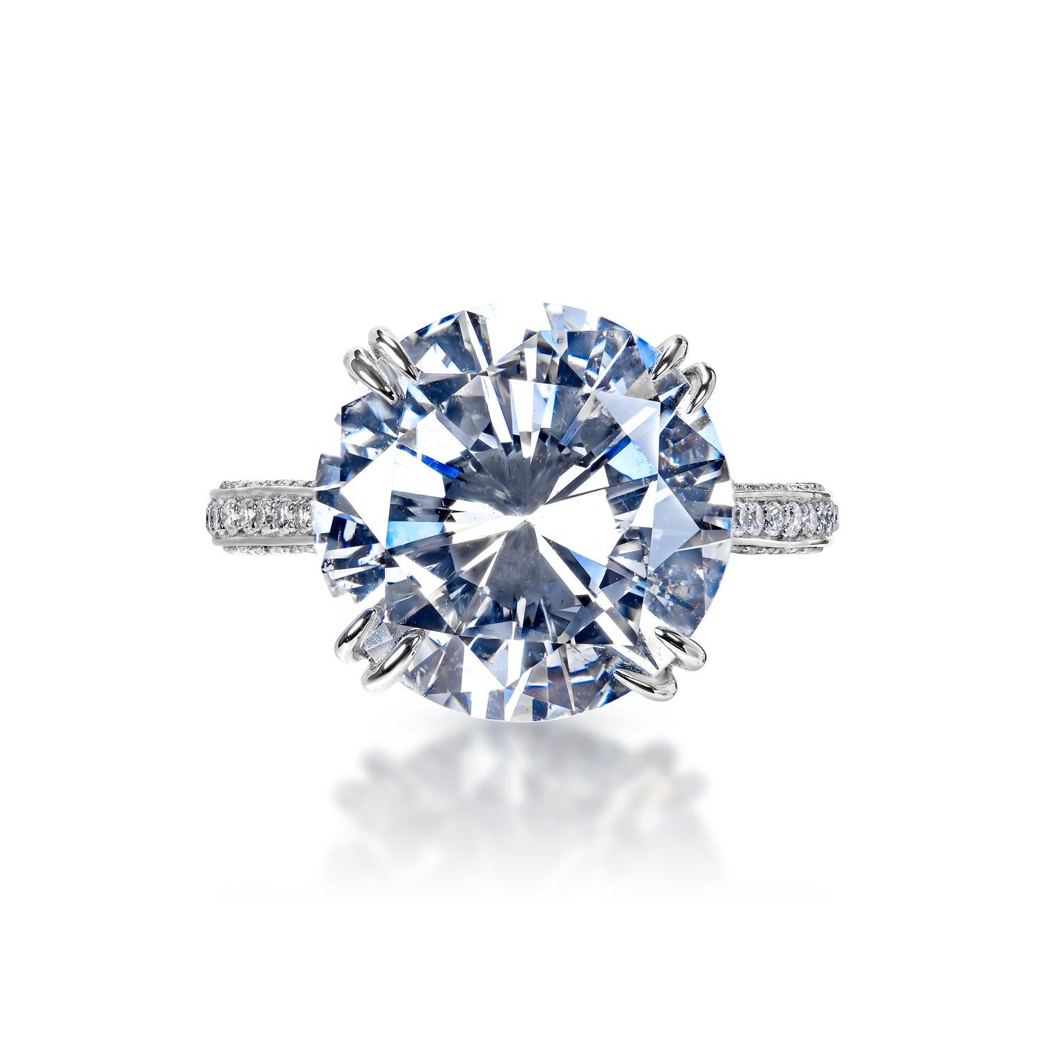 Earth Mined Center Diamond:
Carat Weight: 7.29 Carats
Color: E
Clarity: VS2
Style: Round Brilliant Cut

Carat Weight: 0.54 Carats
Shape: Round Brilliant Cut
Setting: 4 double prong & Micro Pave
Metal: 18 karat White Gold

Total Carat Weight: 7.83