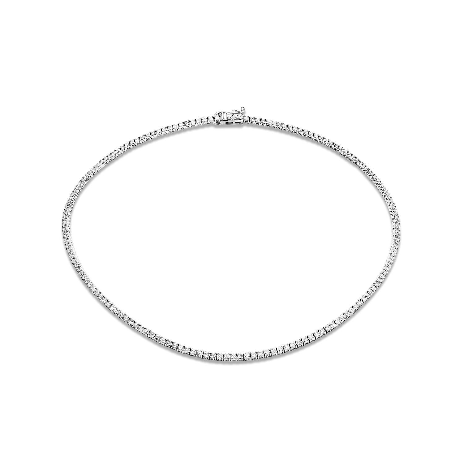 Made from round brilliant cut diamonds set in 14 karat white gold, this necklace is the perfect statement accessory for any occasion. Whether you're going out on the town or attending a formal event, this necklace is sure to turn heads and make a