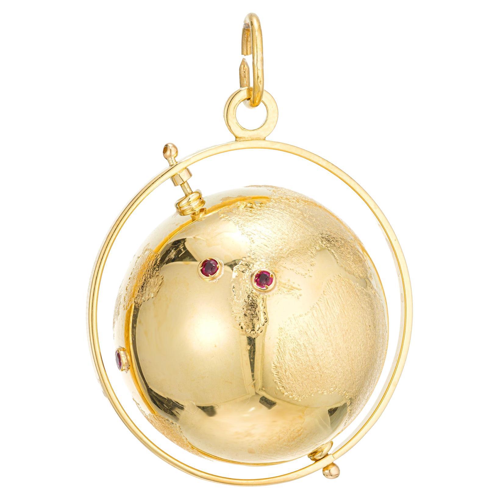 .8 Carat Ruby Yellow Gold Spinning 3D Globe Pendant For Sale