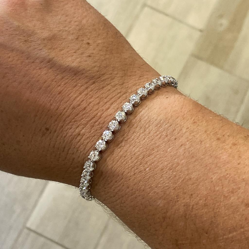 This tennis bracelet has 8 carats of diamonds! These are genuine diamonds set individually in four prongs and each setting is hinged to fit around any shaped wrist. The bracelet is finely crafted with a beautiful flow in your hand and on your wrist.