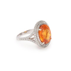 Bague en or blanc 18 carats, grenat spessartite de 8 carats et diamants