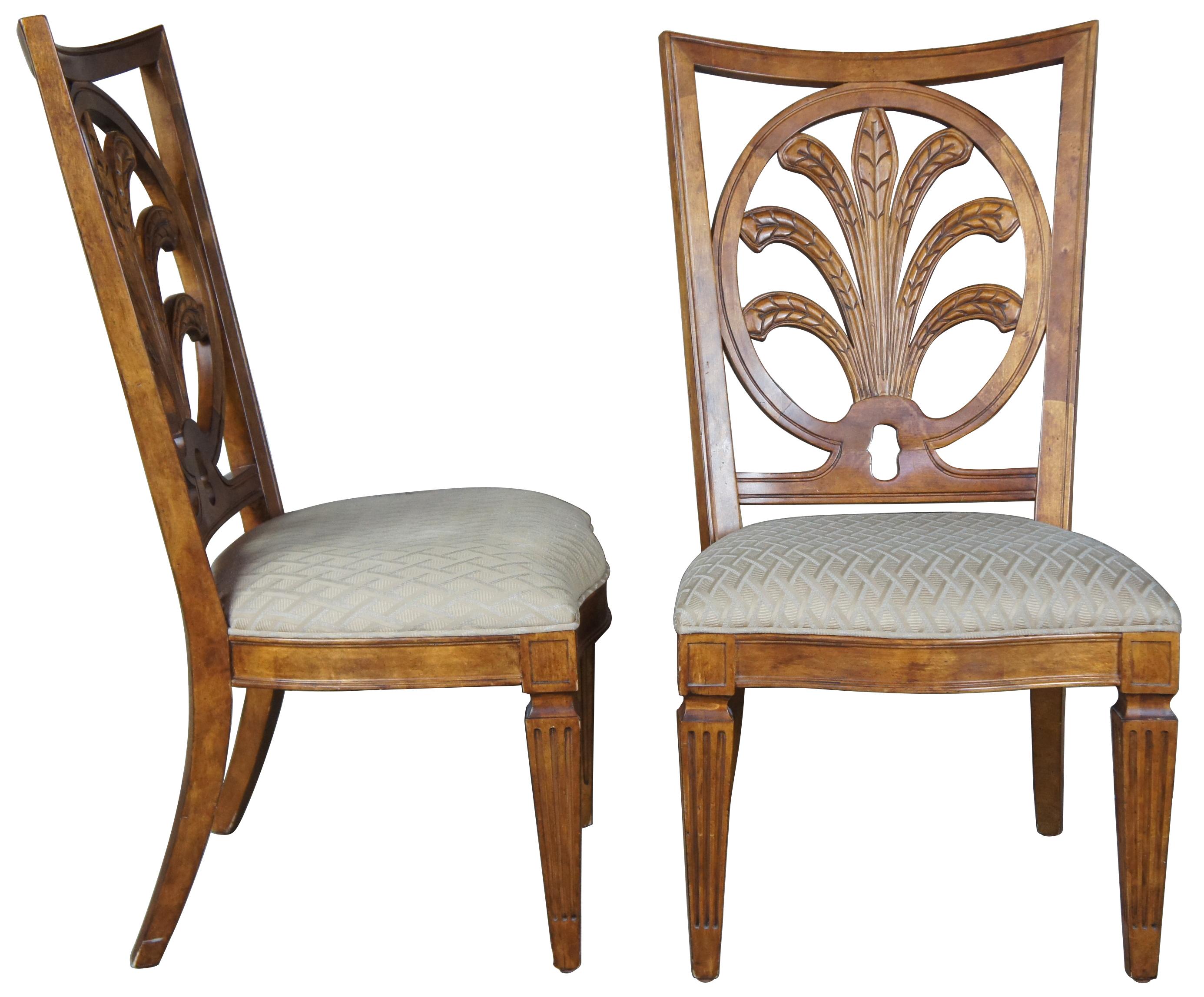 8 Century Furniture Mitsford dining chairs finished in Edinburgh (maple) finish, item #3821 / 52-531. Feature pierced back with round circular sprawling leaf design that resembles a sheath of wheat or acanthus style. An upholstered seat leads to