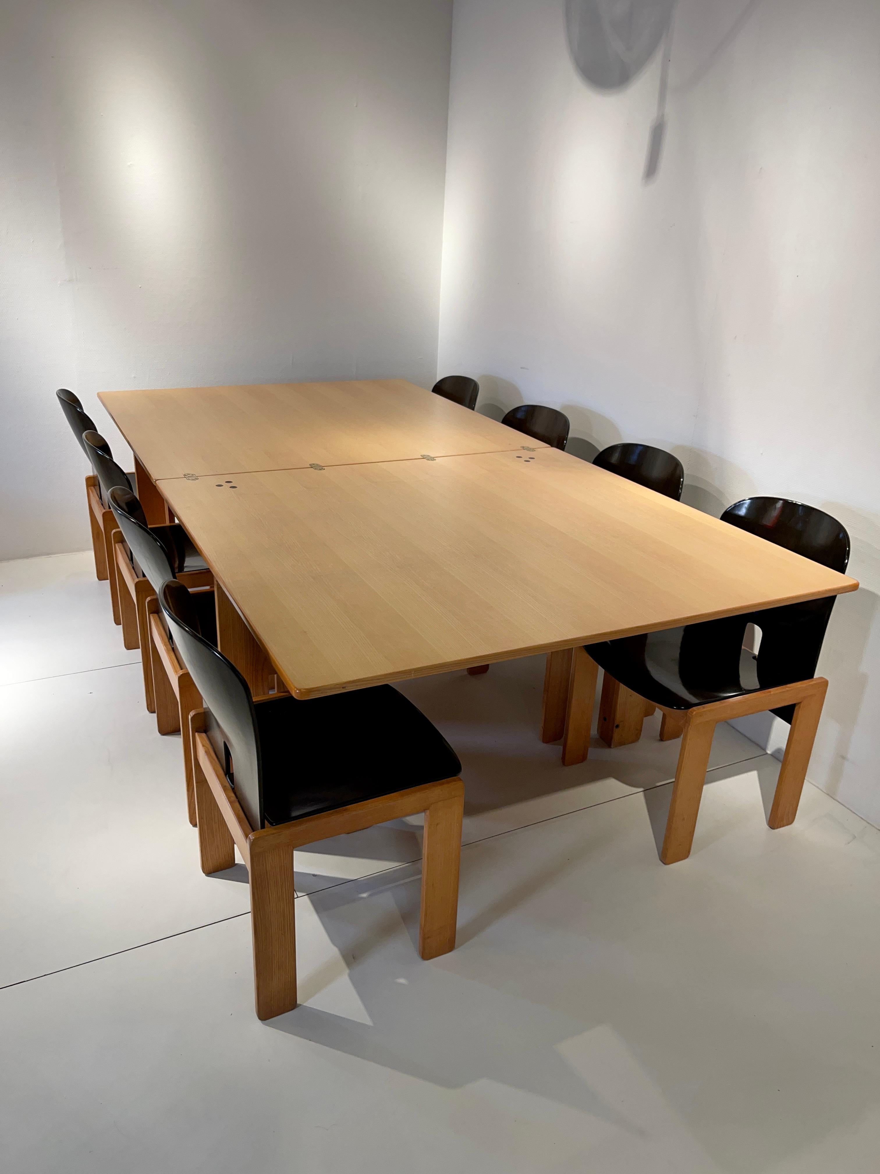Very rare and nice set of 8 chairs ans dining table model 121 designed by Afra and Tobia Scarpa and manufactured by Cassina, Italy 1965. These chairs have walnut wooden frames and plywood seats. Chairs and table are marked with the Cassina sticker.