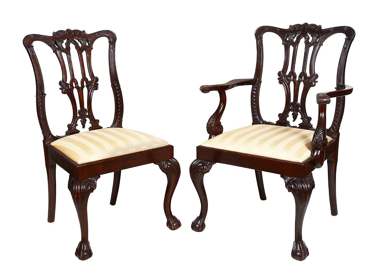 A good quality set of eight 19th Century Mahogany Chippendale style dining chairs. Each with hand carved and pierced gothic influenced decoration to the back rests, drop in upholstered seats and raised on cabriole legs, terminating in ball and claw