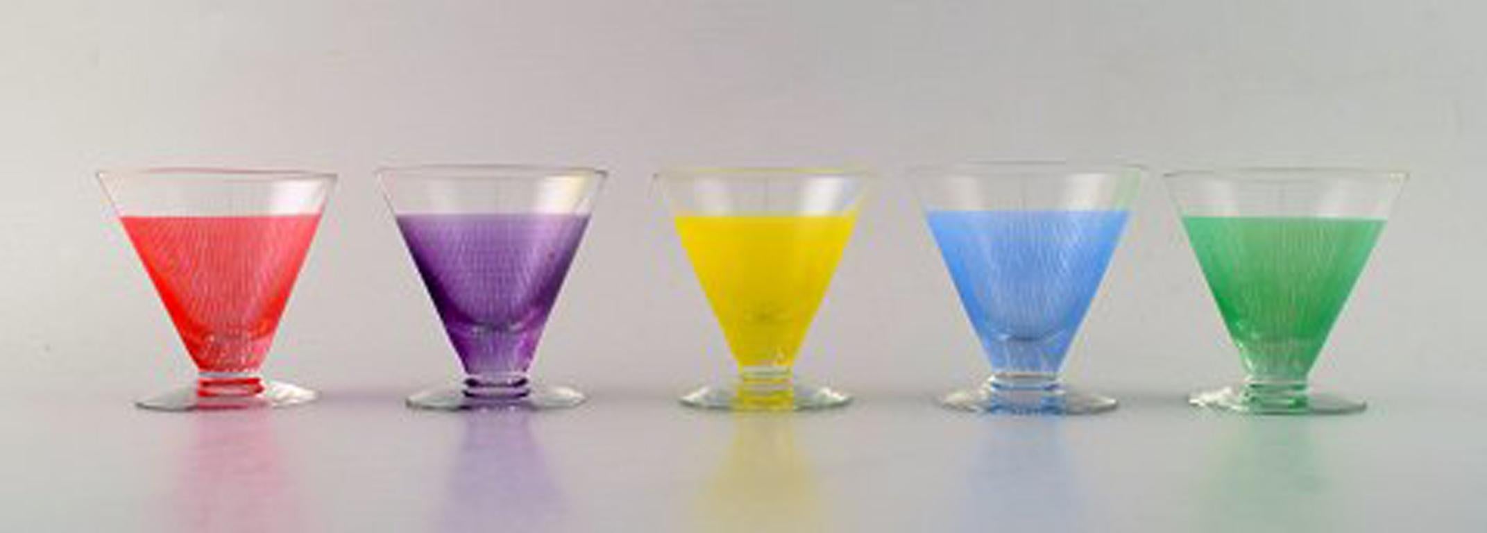 8 colorful cocktail glasses with decanter/bottle. 