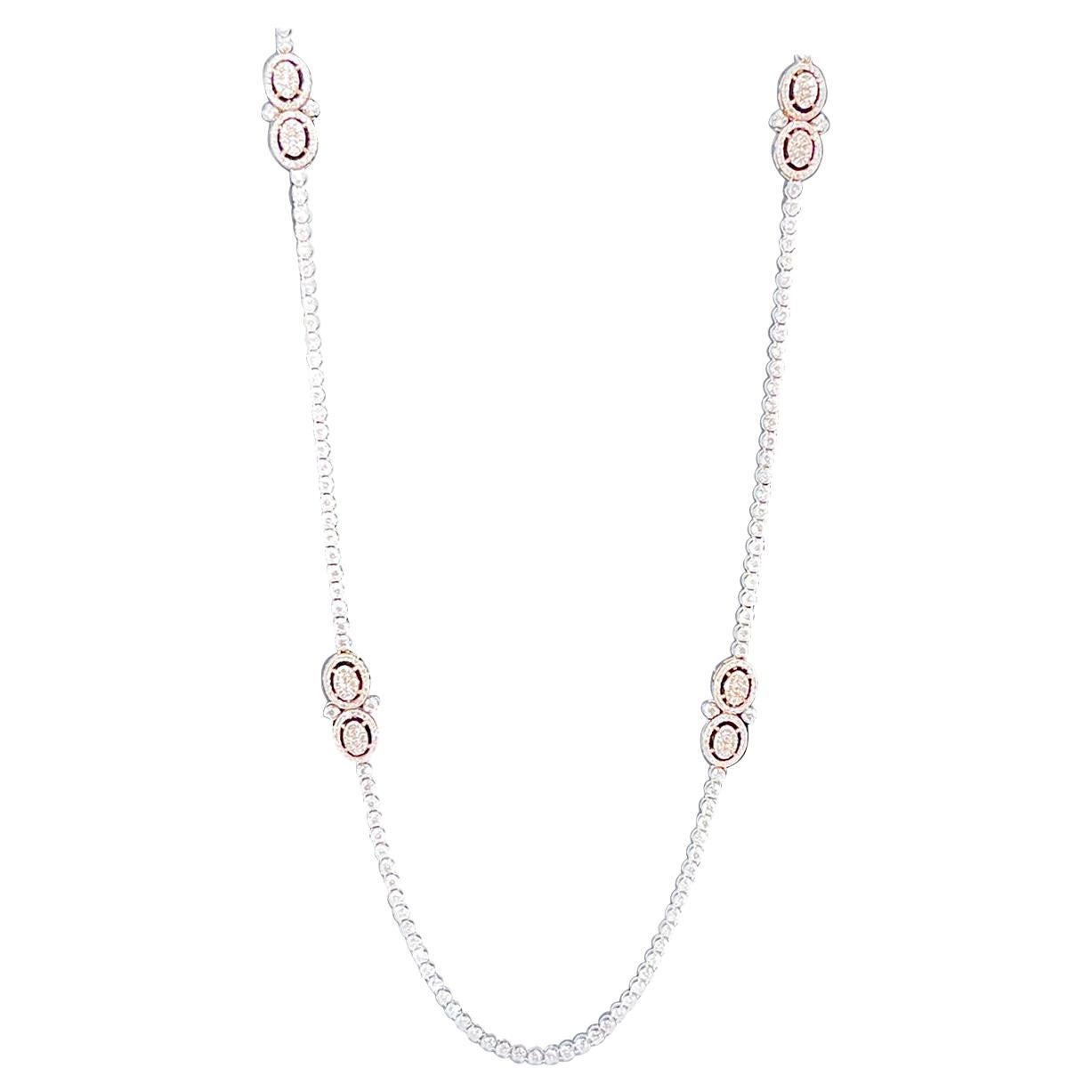 Very Fashionable and in right now is the long opera length necklaces .
This is a 28 inch long necklace with 8 ct of brilliant round cut diamonds.
There are 4 stations of rose gold design with diamonds. 
Please look at all the pictures
14 K gold 27