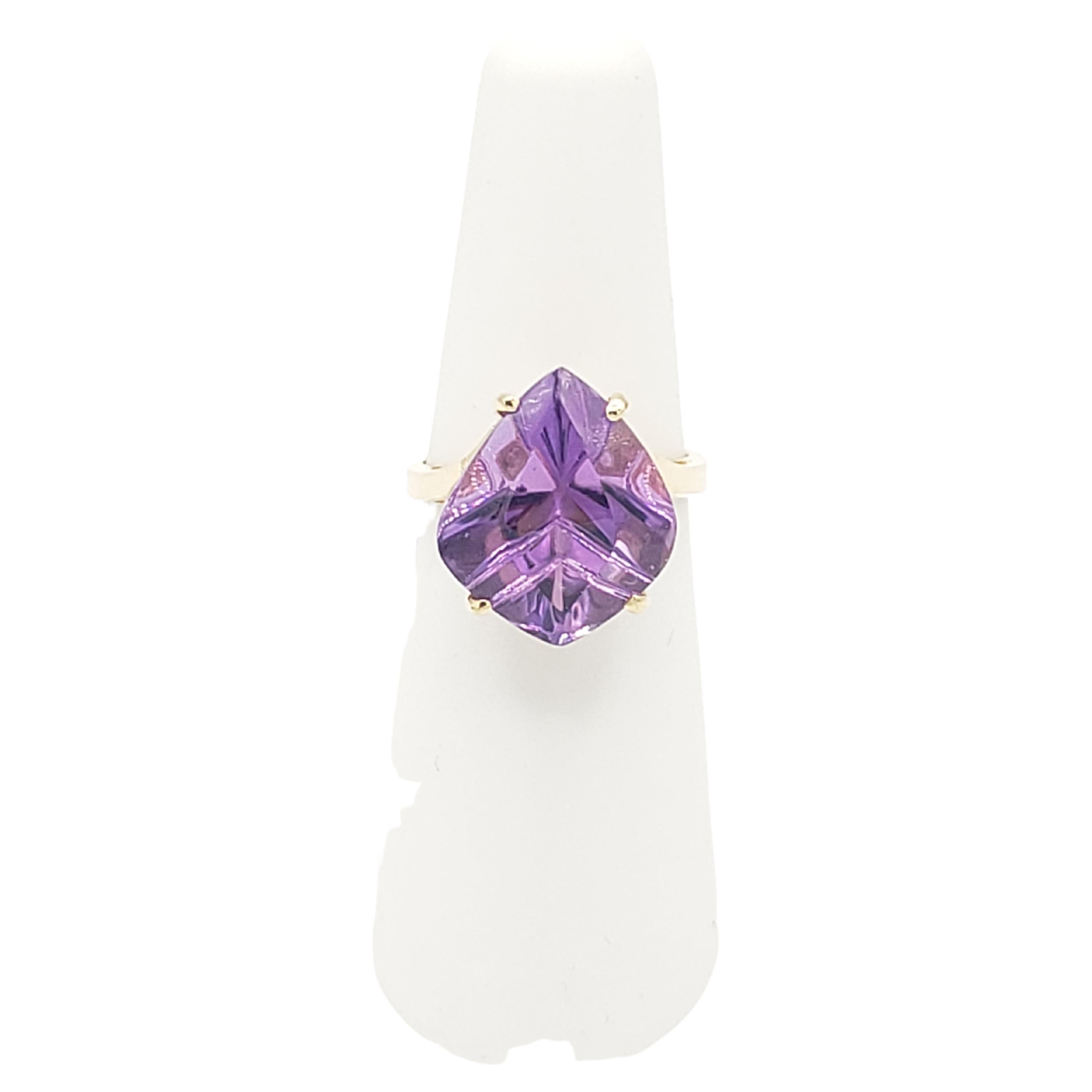 This stunning new ring features an 8 Ct. natural Brazilian AAAA QUALITY VVS amethyst fantasy cut stone set in 14k solid yellow gold. The gemstone's purple hue is beautifully complemented by the warm tone of the gold. Crafted by LaFrancee, this ring