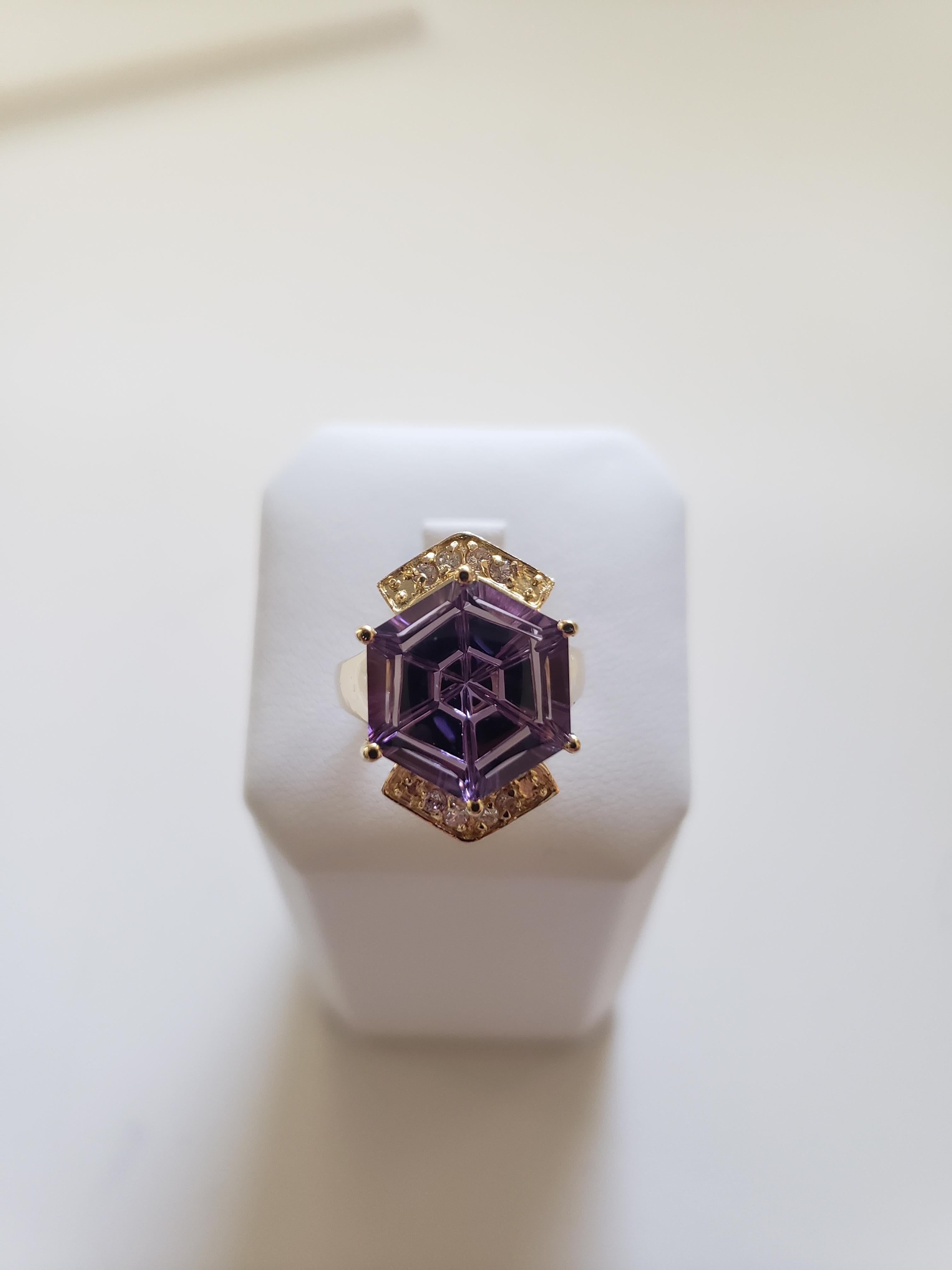 Enhance your jewelry collection with this stunning 14k yellow gold ring. Featuring a beautiful fantasy cut natural Natural Brazilian AAAA Quality VVS Clarity amethyst stone, this ring boasts a total weight of 8 carats. The amethyst stone is