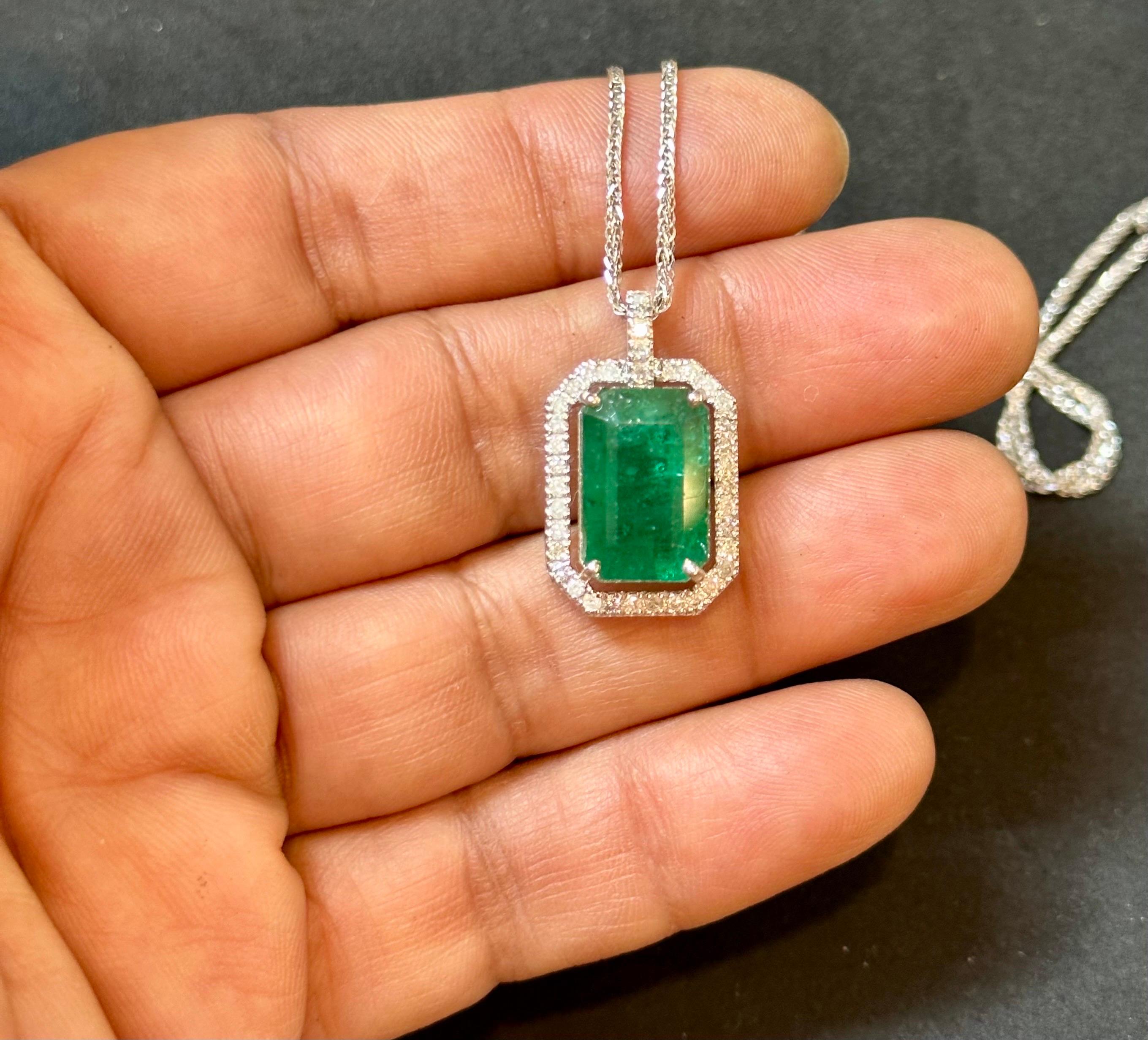 Exact known weight 8.37 Ct Natural Emerald Cut Zambian Emerald Pendant with approximately 0.65 ct of diamond Halo with 14 Karat White Gold Necklace 18