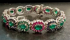 8 Ct Oval Cut Emerald & Ruby & Sapphire Tennis Bracelet 14 Kt White Gold 25.5Gm