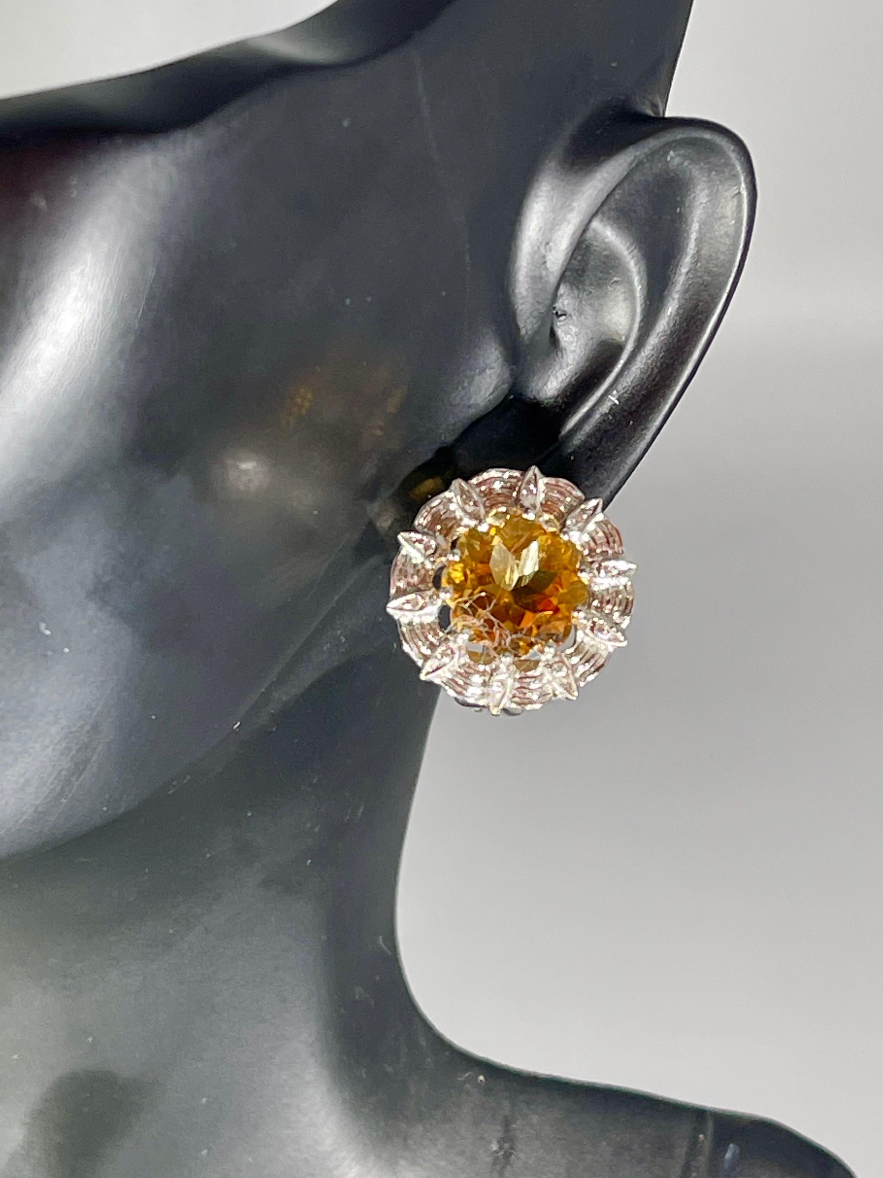 Royal styling from our Collection, these gorgeous earrings set with a prongs set natural round Citrine stones surrounded by 18 karat white gold with tiny diamonds. The 18k gold case is accented with few brilliant cut diamonds. This is a unique piece