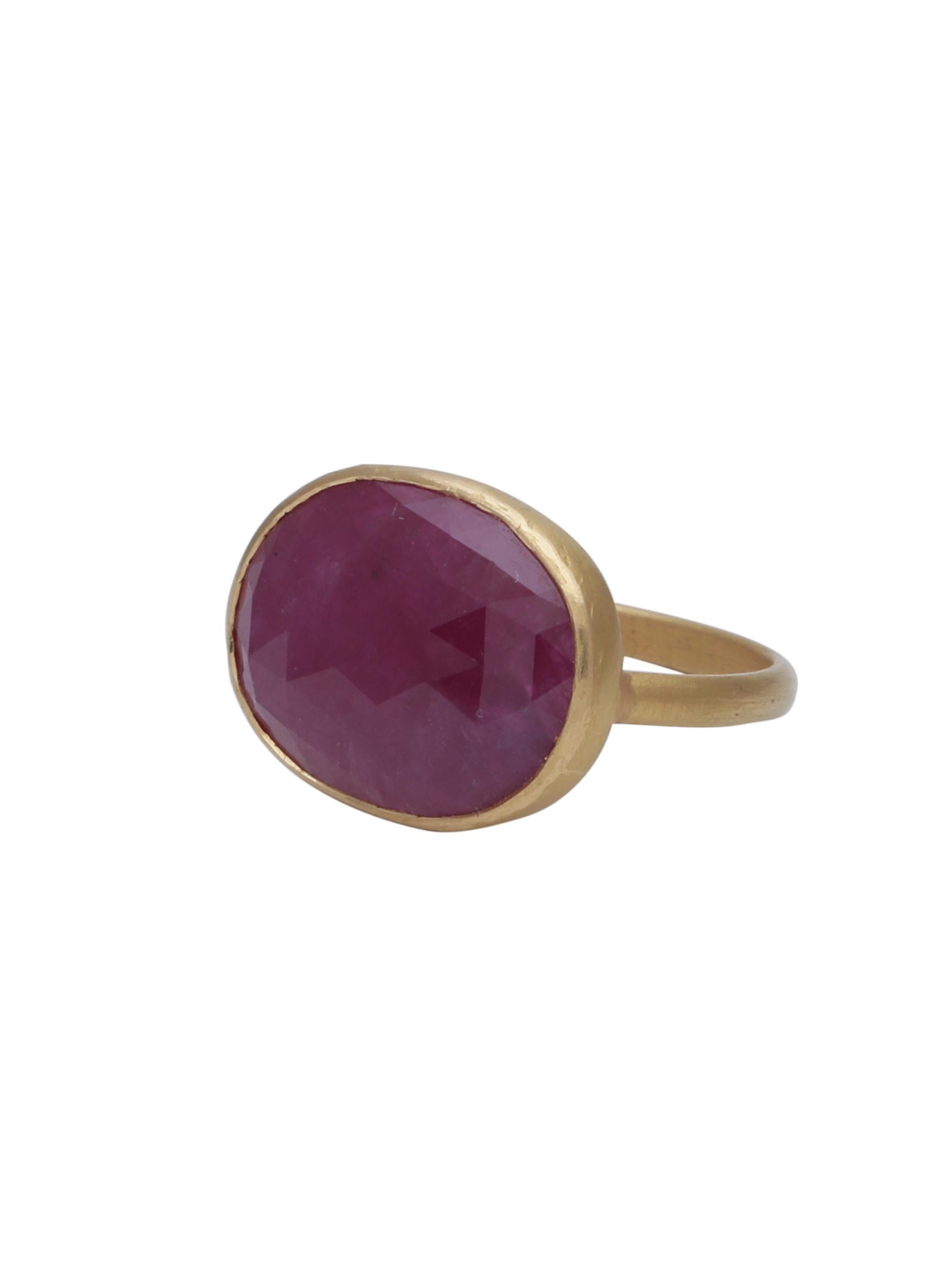 A Handmade ring in 22K gold with a 8cts natural Oval Cut Ruby Centre.
To highlight the colour of the Ruby we have made the ring in Matte Finish that gives it a handmade look aswell and is also the pure color of gold.

Ring Size: US7

