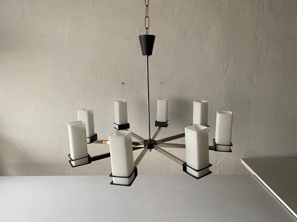 Excellent 8 cylinder opal glass tubes and black-chrome metal body atomic XXL chandelier, 1970s, Germany

The lamp is in very good vintage condition. 

This lamp works with E14 light bulbs.
Wired and suitable to use with 220V and 110V for all