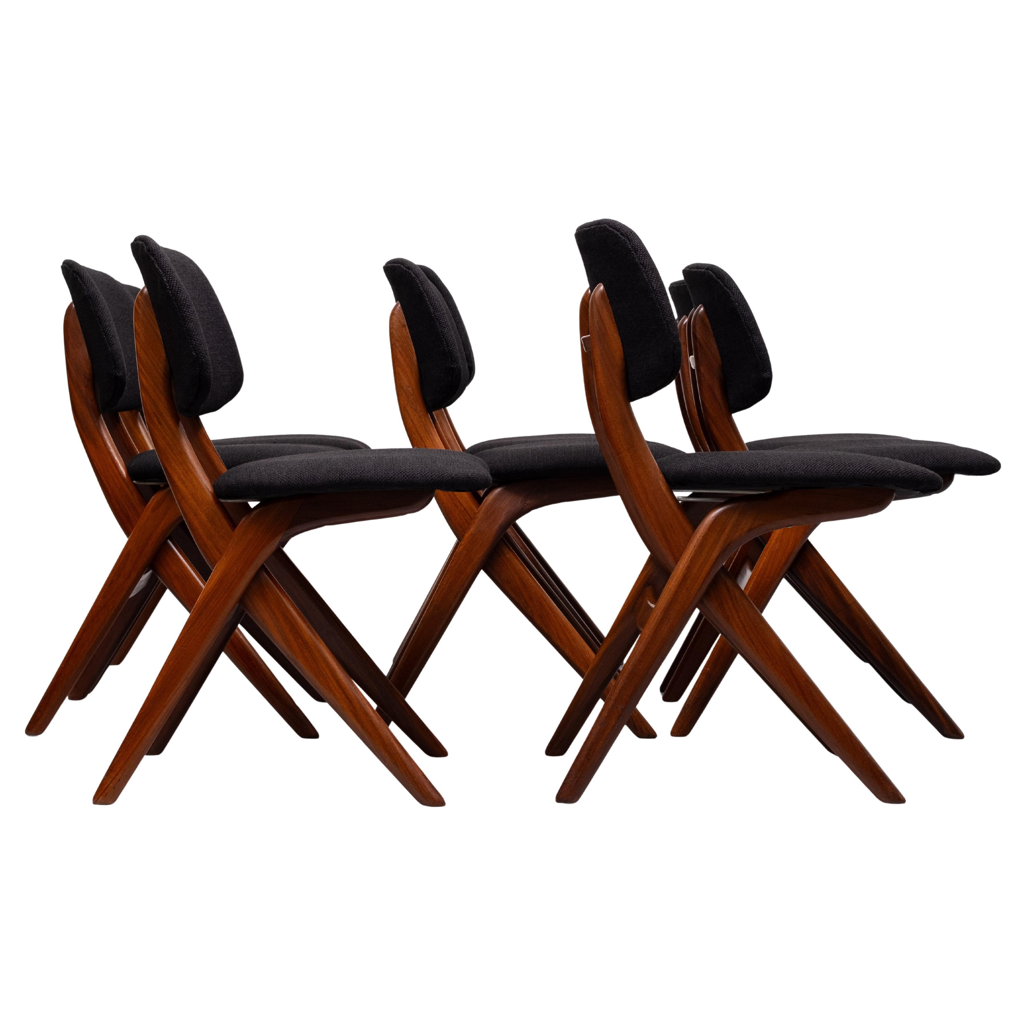 Dutch mid-century dining chairs, 1950s. Made by Louis van Teeffelen for WéBé, he designed this chair with comfort in mind. Also called the scissor or pelican model. Made of solid teakwood . Beautiful organic design .
Comes with a brand new Black