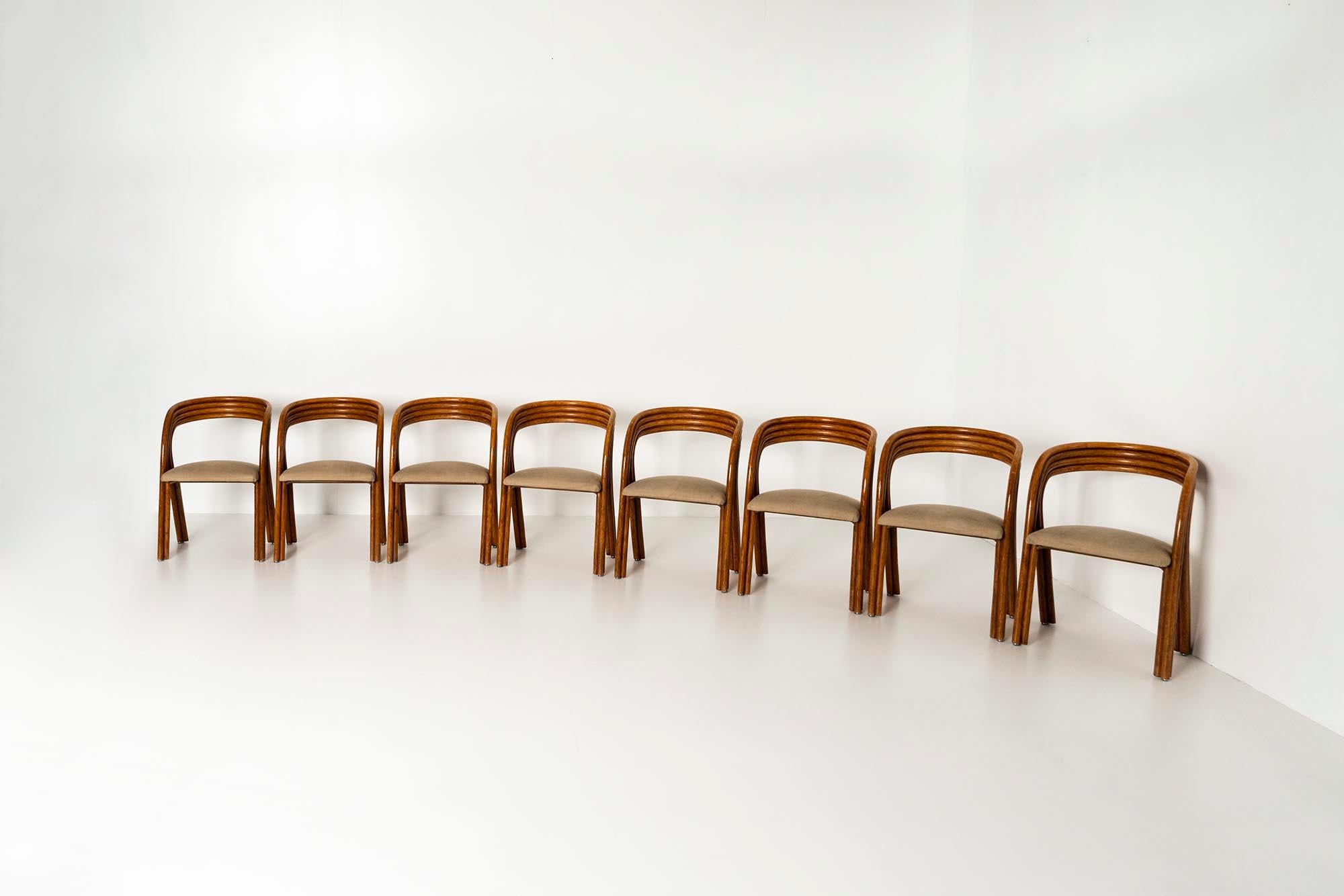 Eight very eye-catching chairs designed by the Belgian designer Axel Enthoven for Rohé Design in 1980. What is immediately striking about this multi-award winning design is the beautiful patina that the manou wood (sanded bamboo) shows. The color