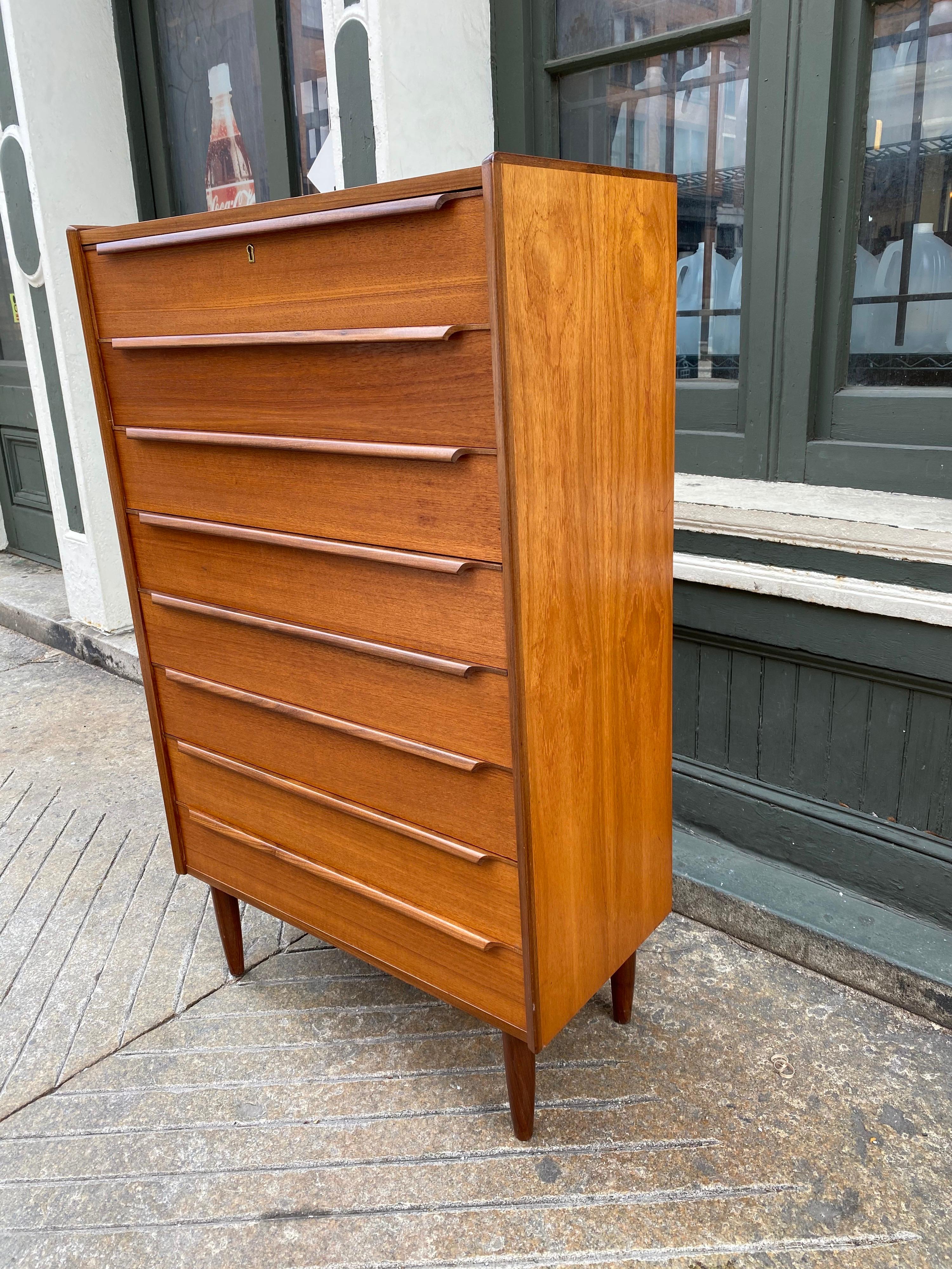 Unique and extra tall Danish teak tall boy dresser. Dresser is exceptionally clean and all original. Inside drawers are in great clean condition as well. Have been selling Danish furniture for many years and this is the first extra tall dresser I