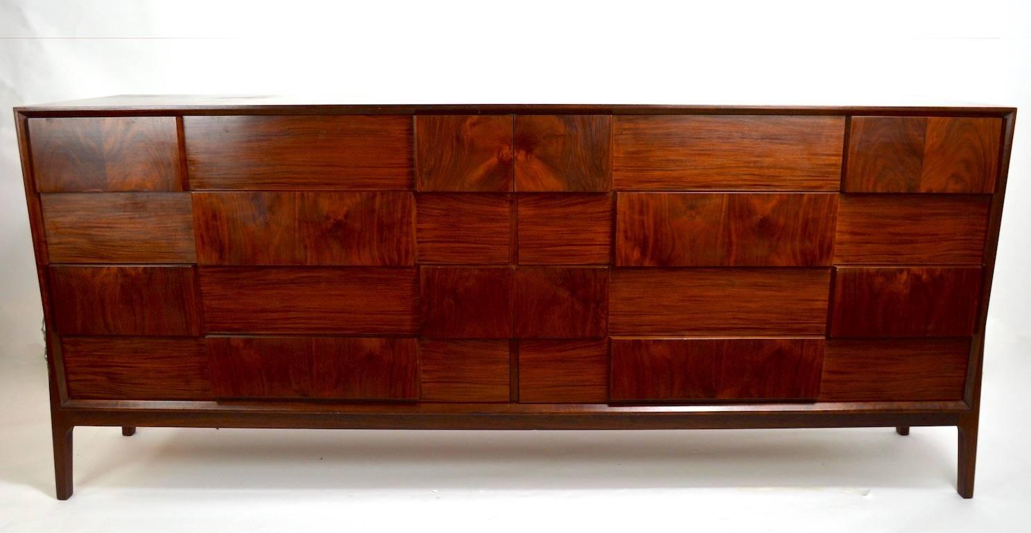 Gorgeous large eight-drawer dresser in rosewood, by Piet Hein, made in Denmark. Eight deep drawers provide ample storage, well constructed, nice original condition (shows minor cosmetic wear, normal and consistent with age) clean, ready to