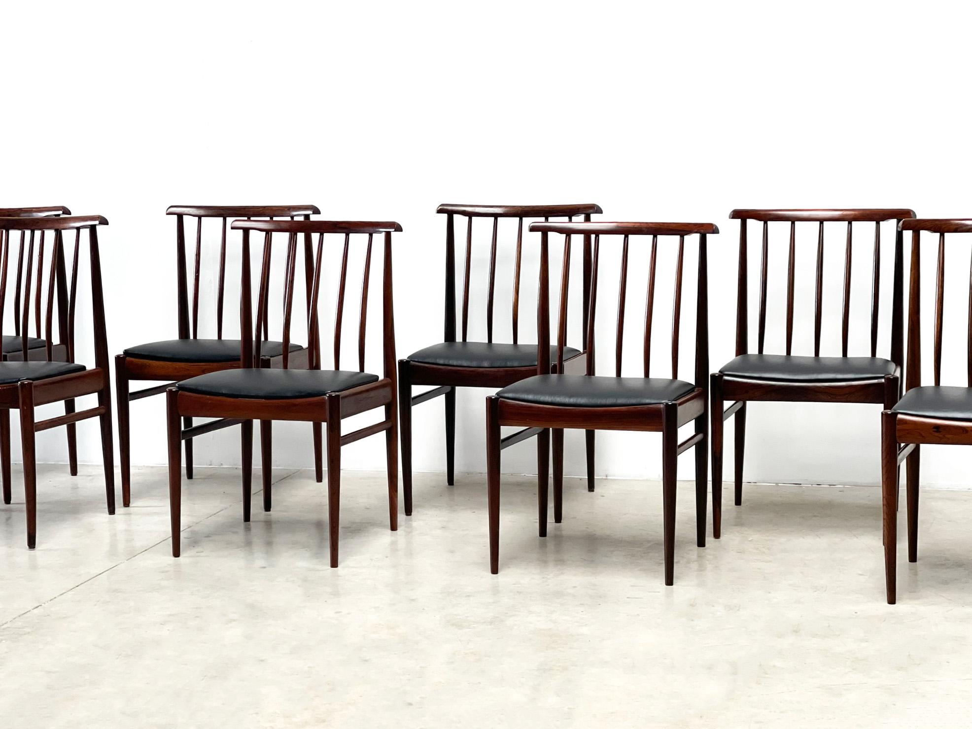 Beautiful set of 8 rosewood dining chairs. It is rare to find a set of 8 chairs of this quality. The set of 8 is in absolute mint condition with minimal signs of use.The seats have all been replaced and received new leather. The set was made by AWA.