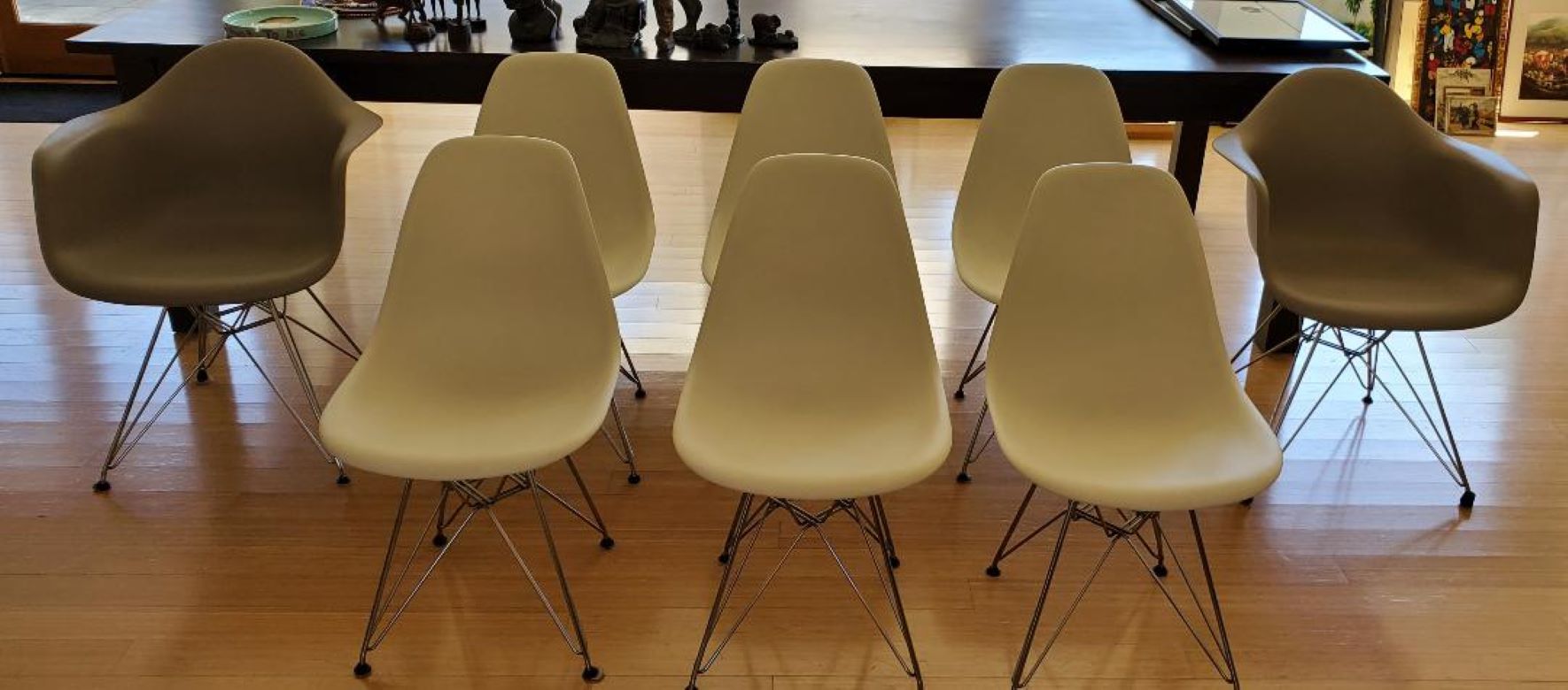 8 Eames molded plastic chairs, 2 DAR arm chairsand 6 DSR side chairs with Eiffel Tower bases for dining and office.

