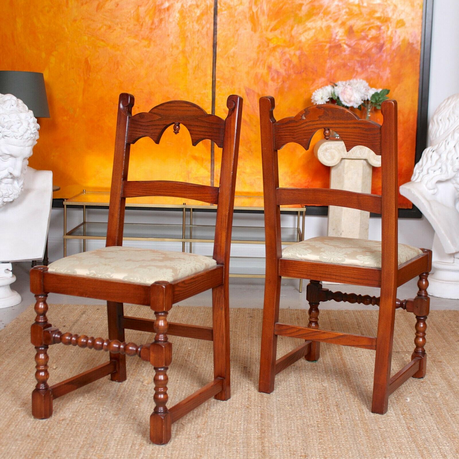 An impressive set of eight fine quality oak dining chairs by Bevan Funnel.

Carved from thick cuts of solid oak with a nicely figured and patina.