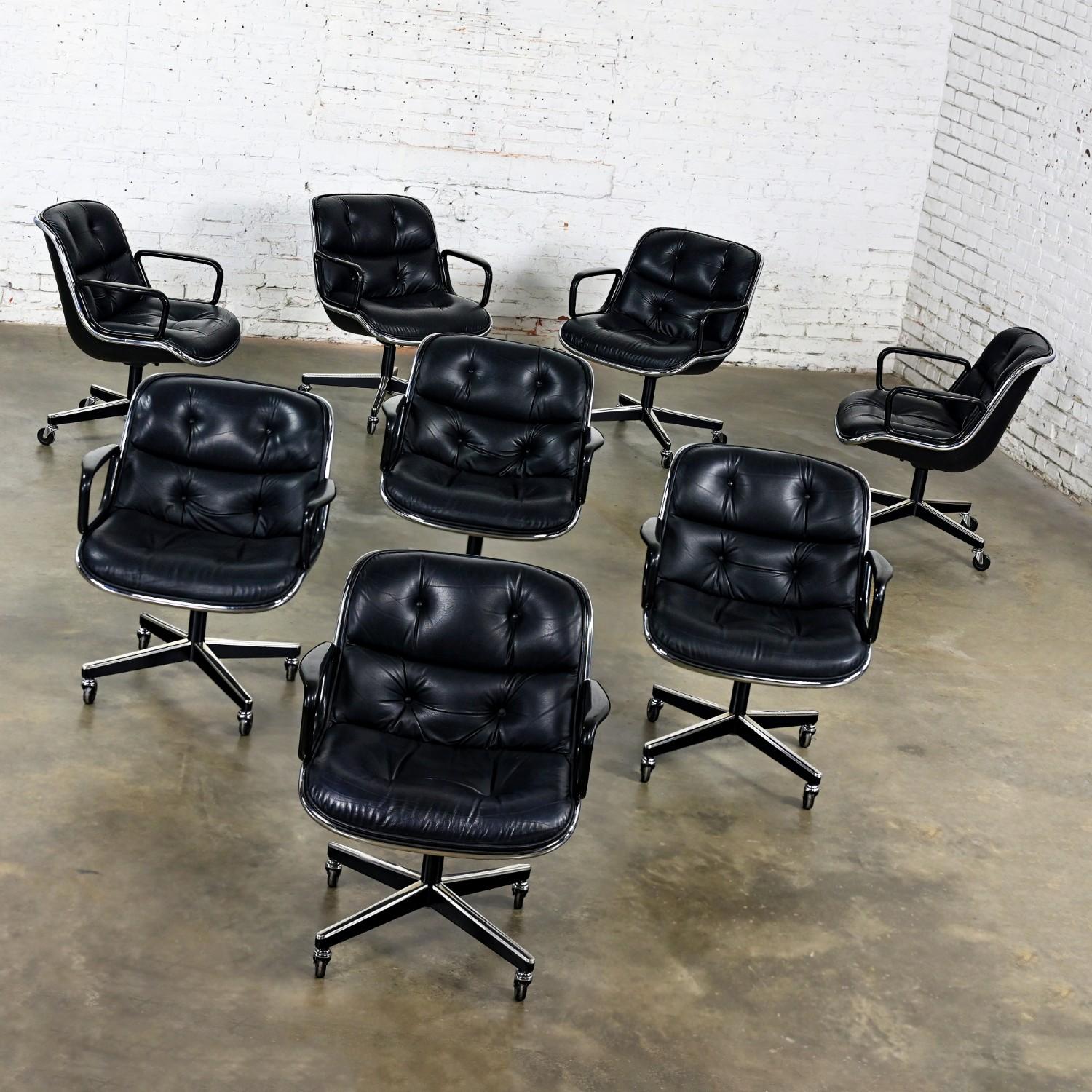 Classic MCM (Mid-Century Modern) to Modern Executive armchairs by Charles Pollock for Knoll set of 8. Each chair is comprised of a black leather seat and back with button detail, aluminum band, chrome shaft, black plastic arms, and a 4-prong