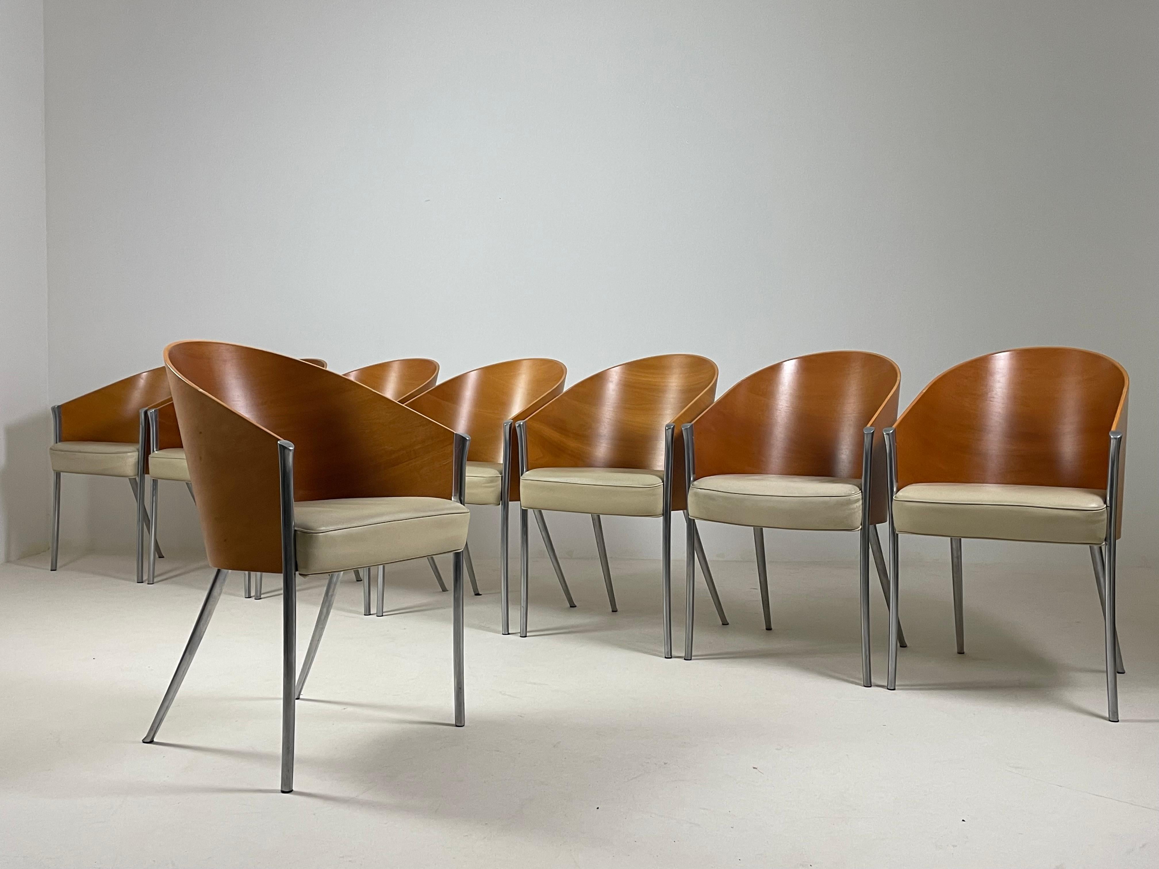 Set of 8 King Costes Model Armchairs by designer Philippe Starck and produced by Aleph/driade in the 1990s. Base in polished cast aluminum. Bultex foam seat covered in ivory cowhide leather. Molded wood back with mahogany facing. Recurring signs of