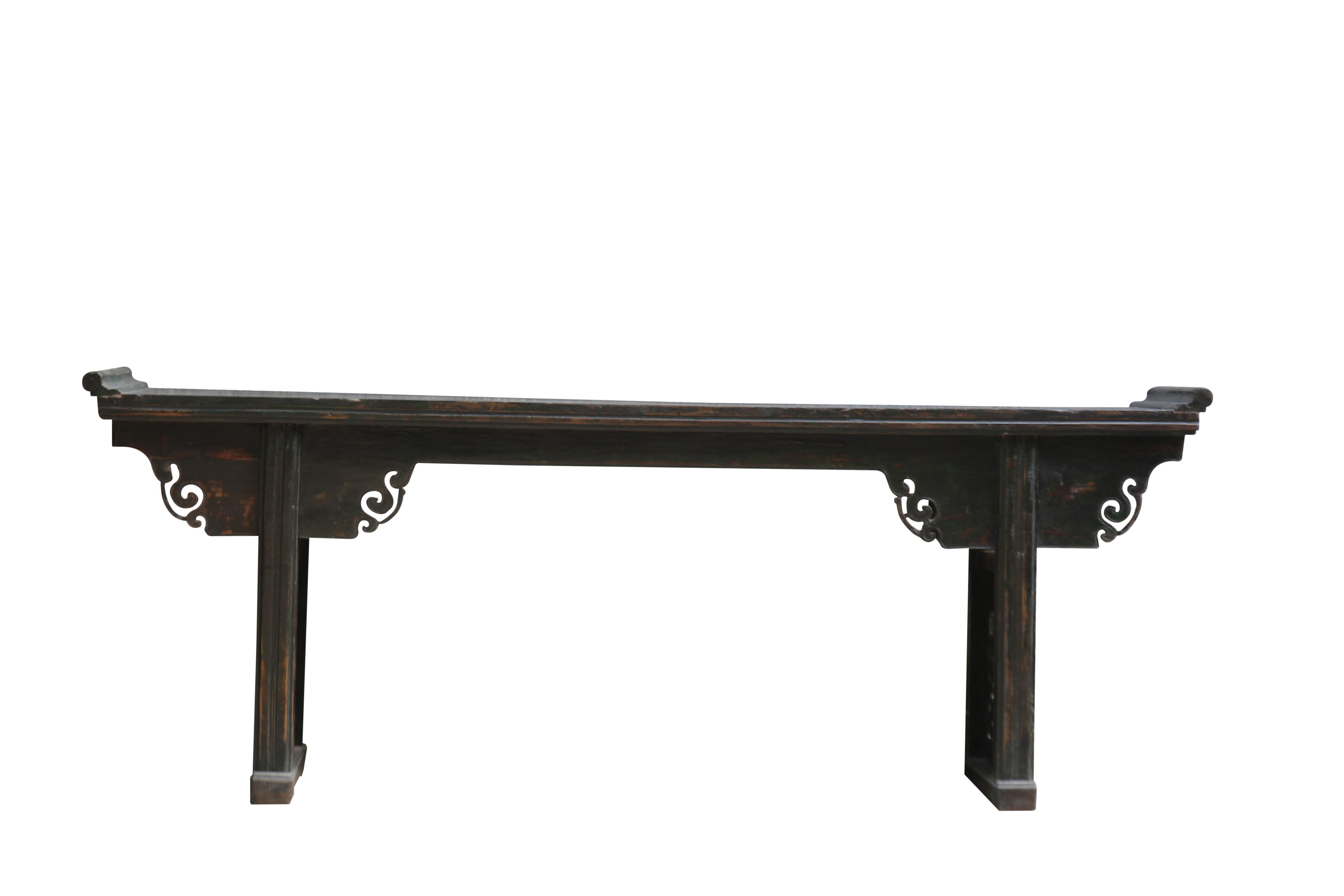 This large long antique altar table has a pair beautifully hand carved panel legs. The wide paneled spandrels decorated with a few carved curly tendrils under the top of the table add a balanced robust to this magnificent table. This 8 feet long