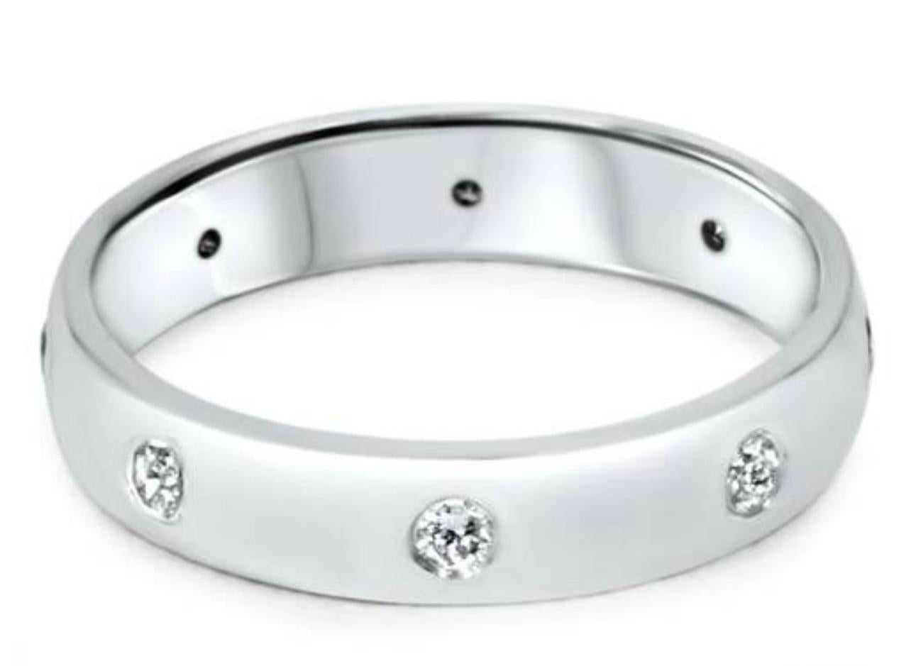 8 Flush Set Bezel Diamond Eternity Wedding Band in 14 Karat White Gold Size 7 
Very clean and shiny diamonds. Approximately 2 Pointer each , approximately 0.16 ct Total diamond weight .

This eternity band features Gypsy set or burnished, the bright