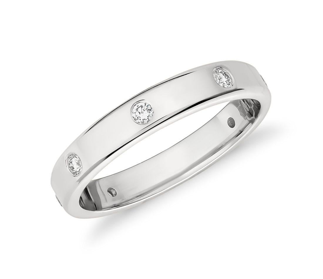 8 Flush Set Bezel Diamond Eternity Wedding Band in 14 Karat White Gold Size 9  
Very clean and shiny diamonds. Approximately 4 Pointer each , approximately 0.30 ct Total diamond weight .

This eternity band features Gypsy set or burnished, the
