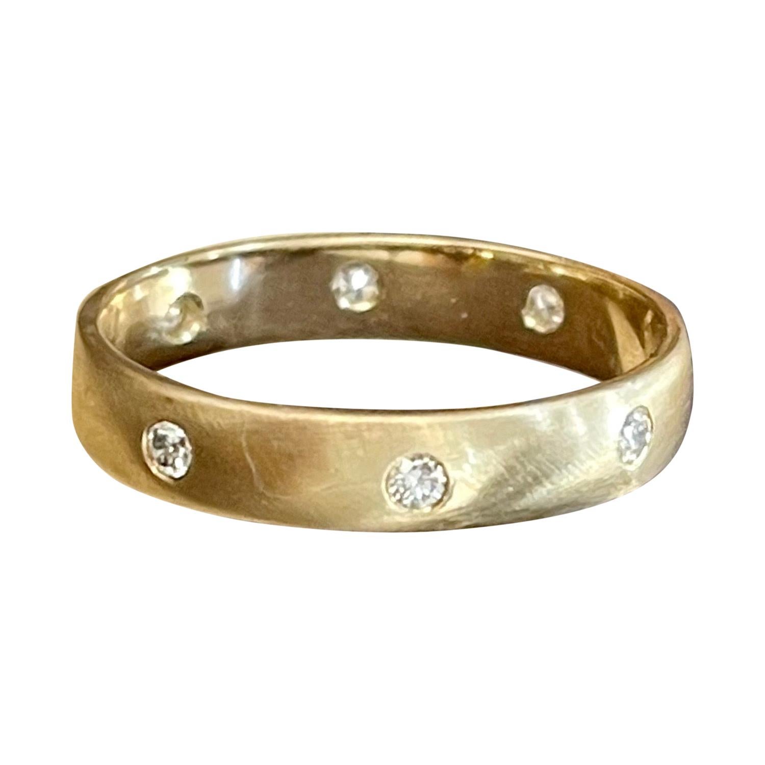 8 Flush Set Bezel Diamond Eternity Wedding Band in 14 Karat Yellow Gold Size 11
All 8 diamonds are scattered uniformly all around the band 
Very clean and shiny diamonds.
5 pointer diamonds are used 
total weight of the diamond is 0.40ct
This