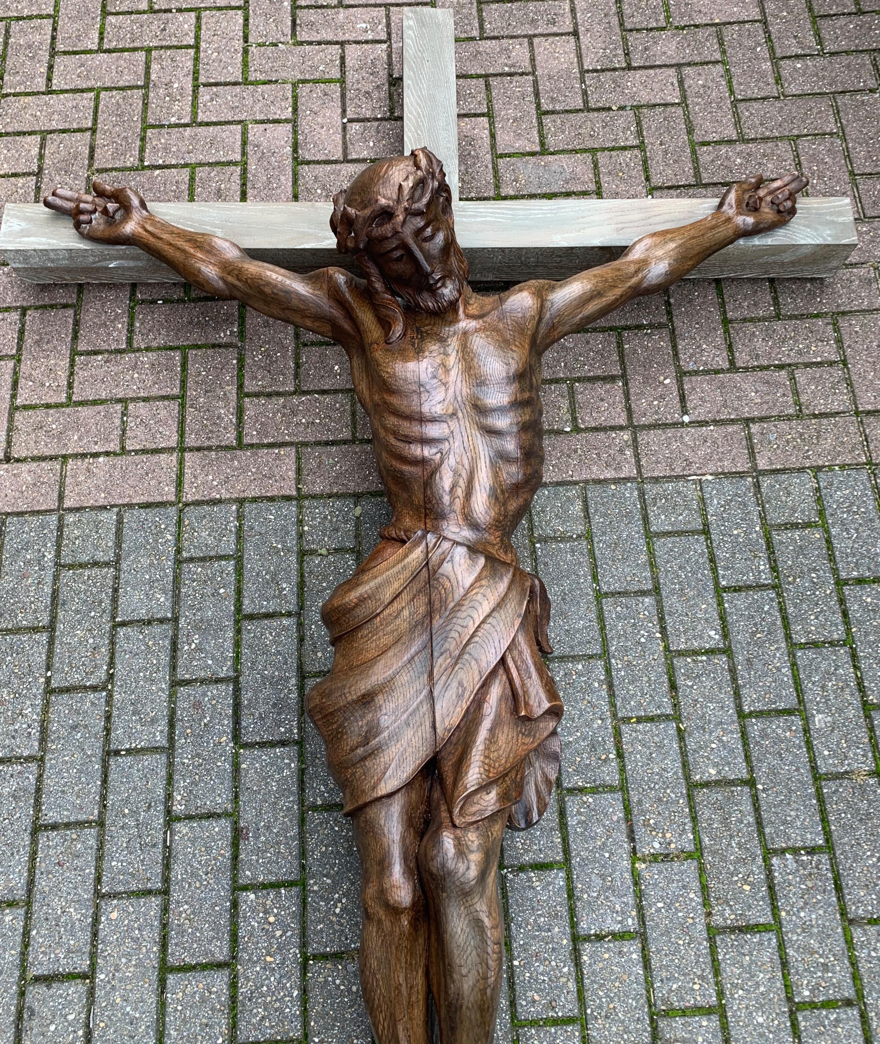 Beautifully carved and large size corpus of Jesus, made in the Arts & Crafts era.

This meaningful and unique crucifix from the early 1900s comes with a larger than life, hand carved oak Corpus of Christ. The details in the anatomy of this Christ